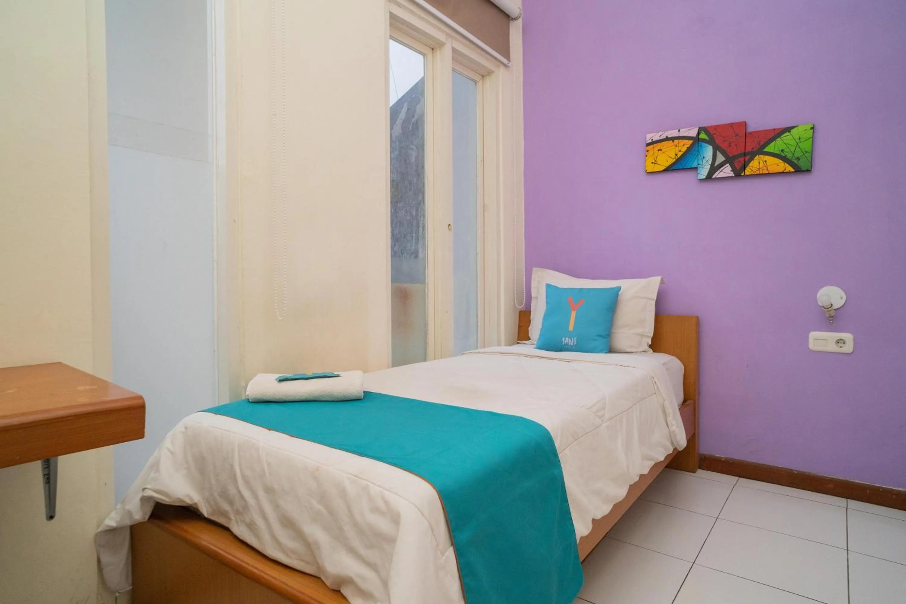 Bed in Sans Hotel FiFFa Pisang Kipas Malang