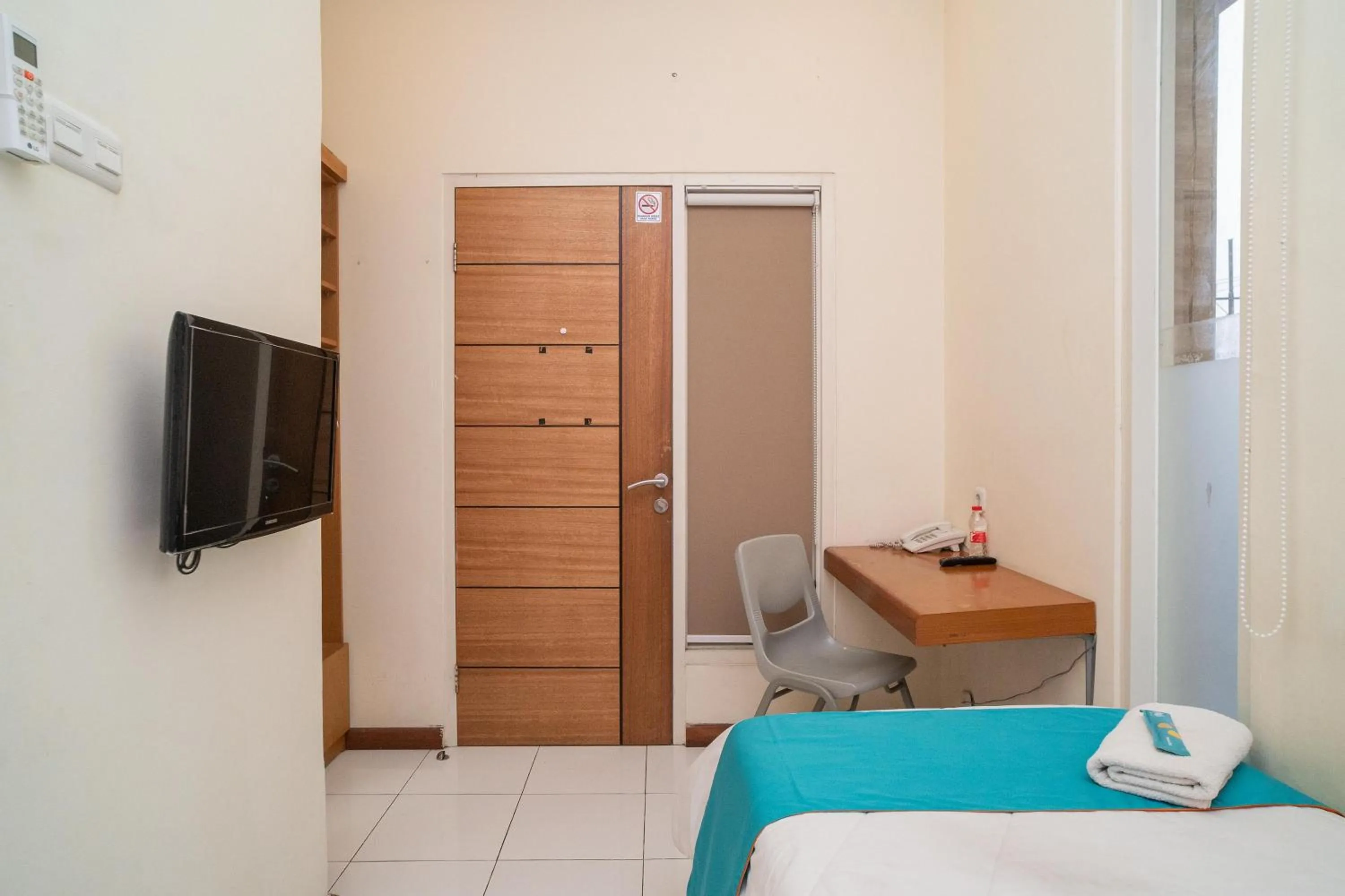 Bed in Sans Hotel FiFFa Pisang Kipas Malang