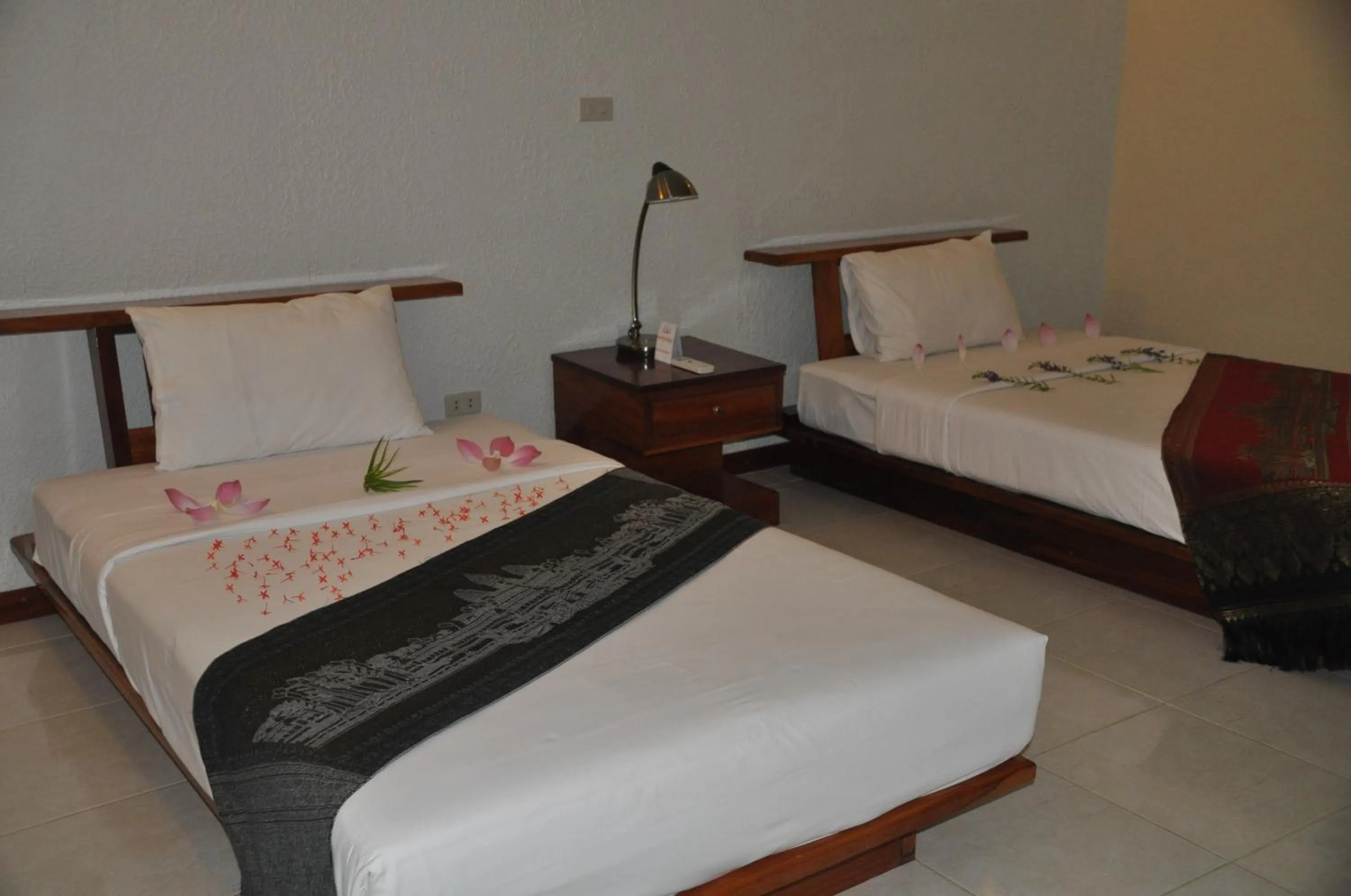 Bed in Memoria Palace & Resort