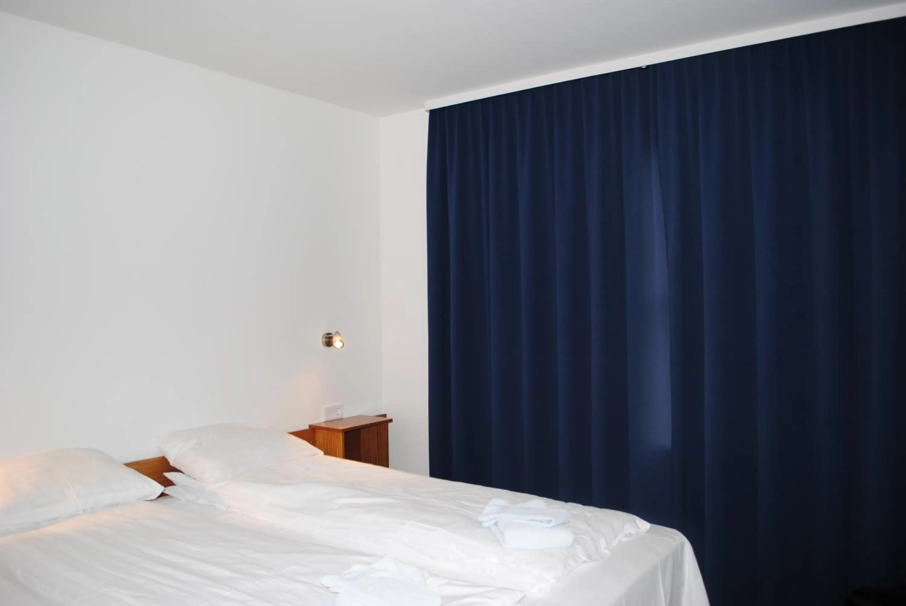 Bed in Brunnholl Country Guesthouse