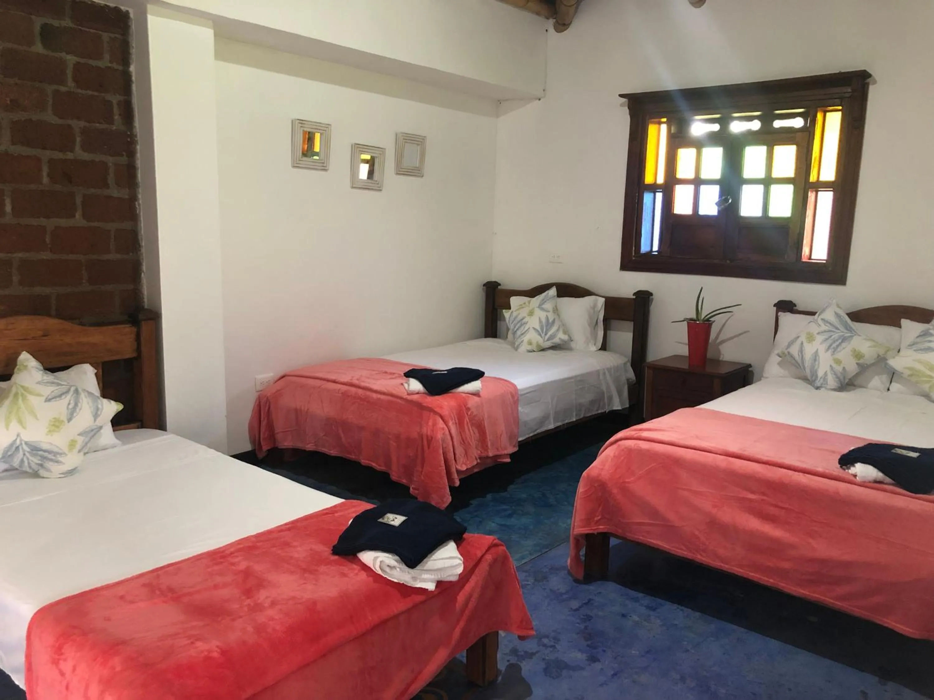 Bed in Finca Hotel Brasilia