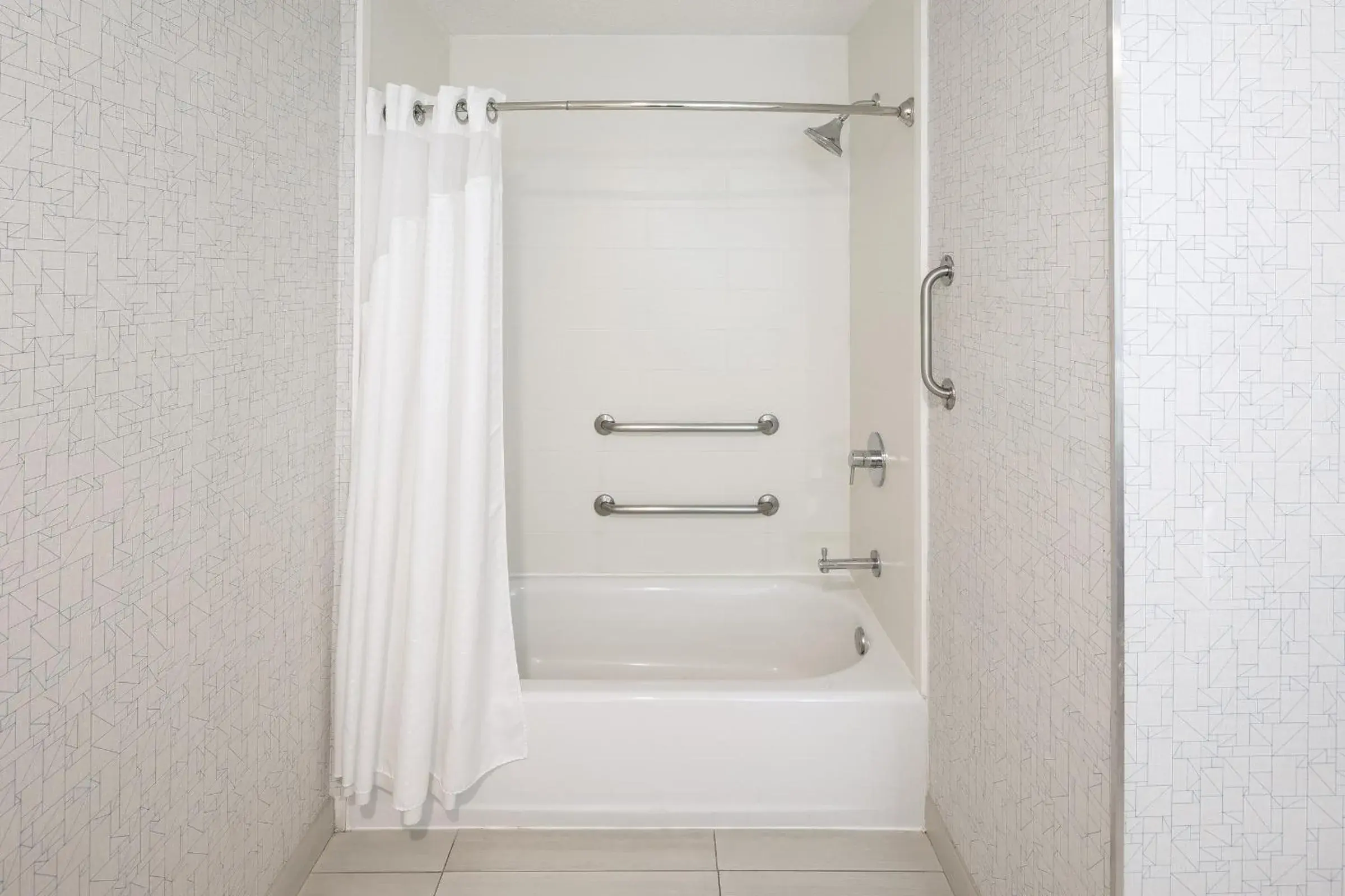 Bathroom in Holiday Inn Express & Suites Chicago West - St Charles by IHG Bathroom in Holiday Inn Express & Suites Chicago West - St Charles by IHG