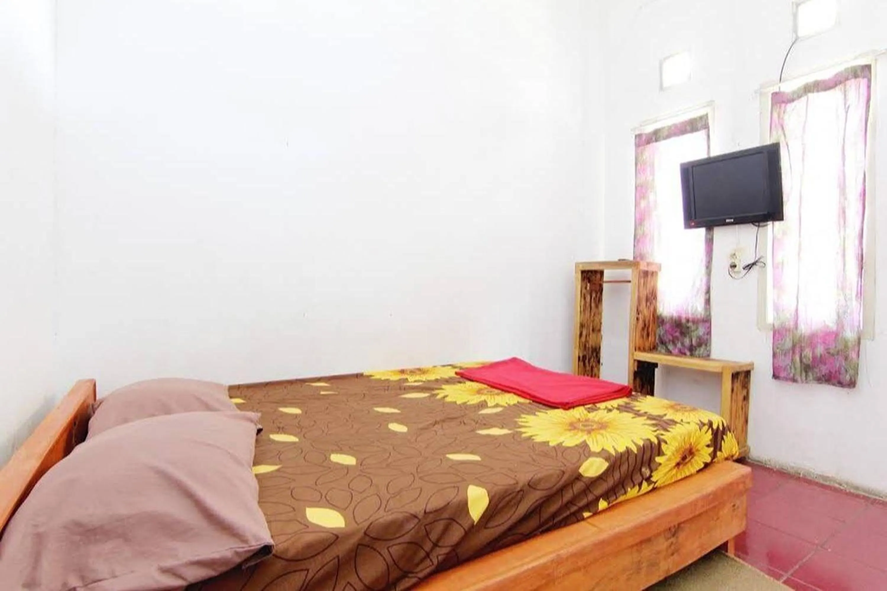 Bed in Villa Penginapan Purnama