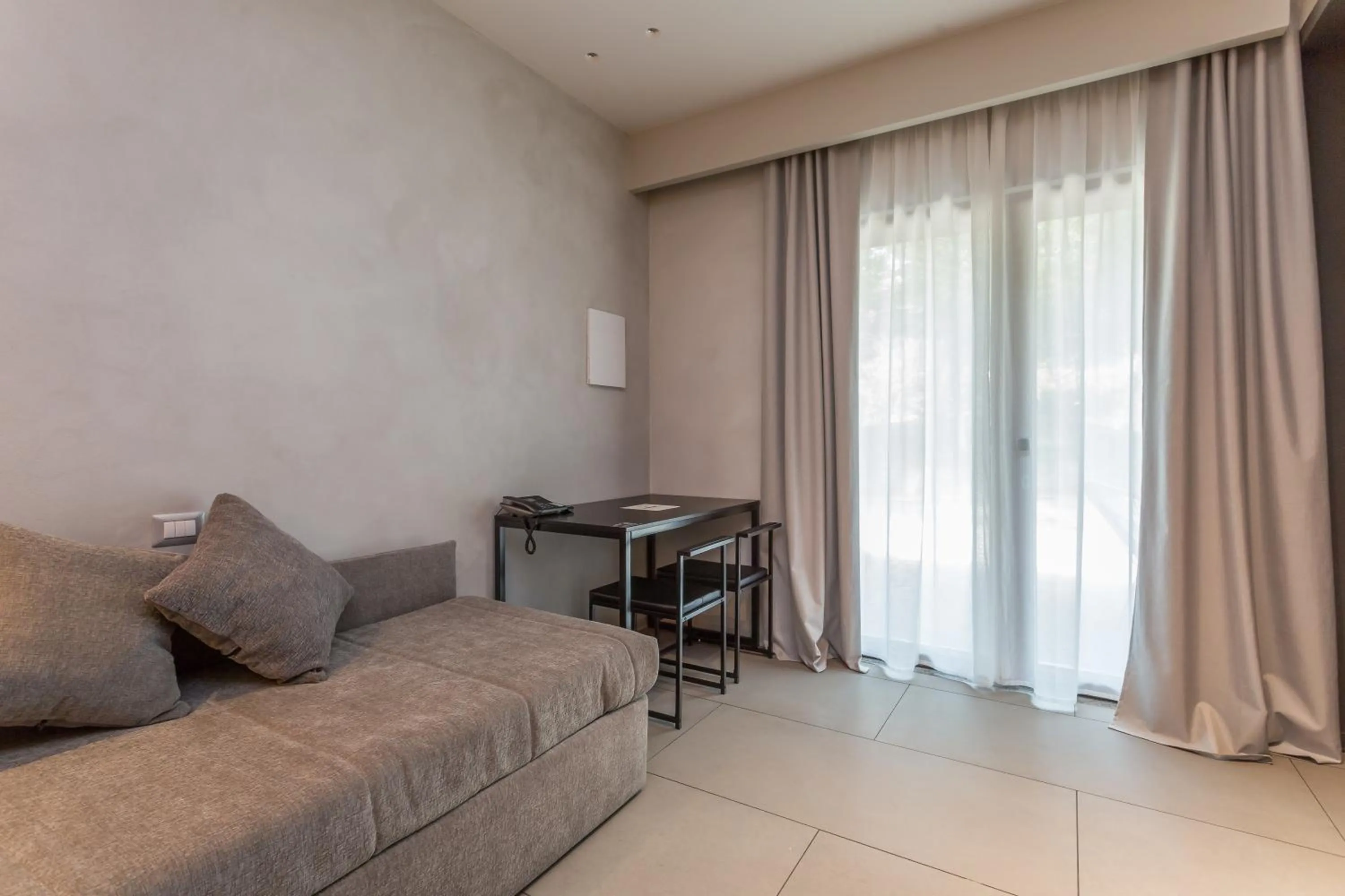 Living room, Bed in Fauno Urban Resort