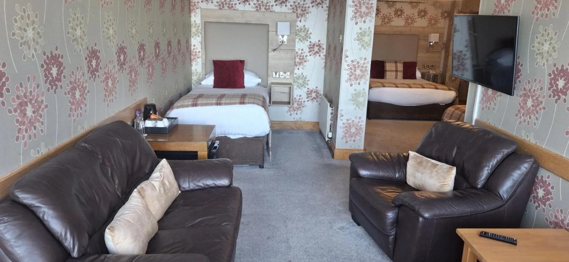 Seating area, Bed in Royal Court Hotel