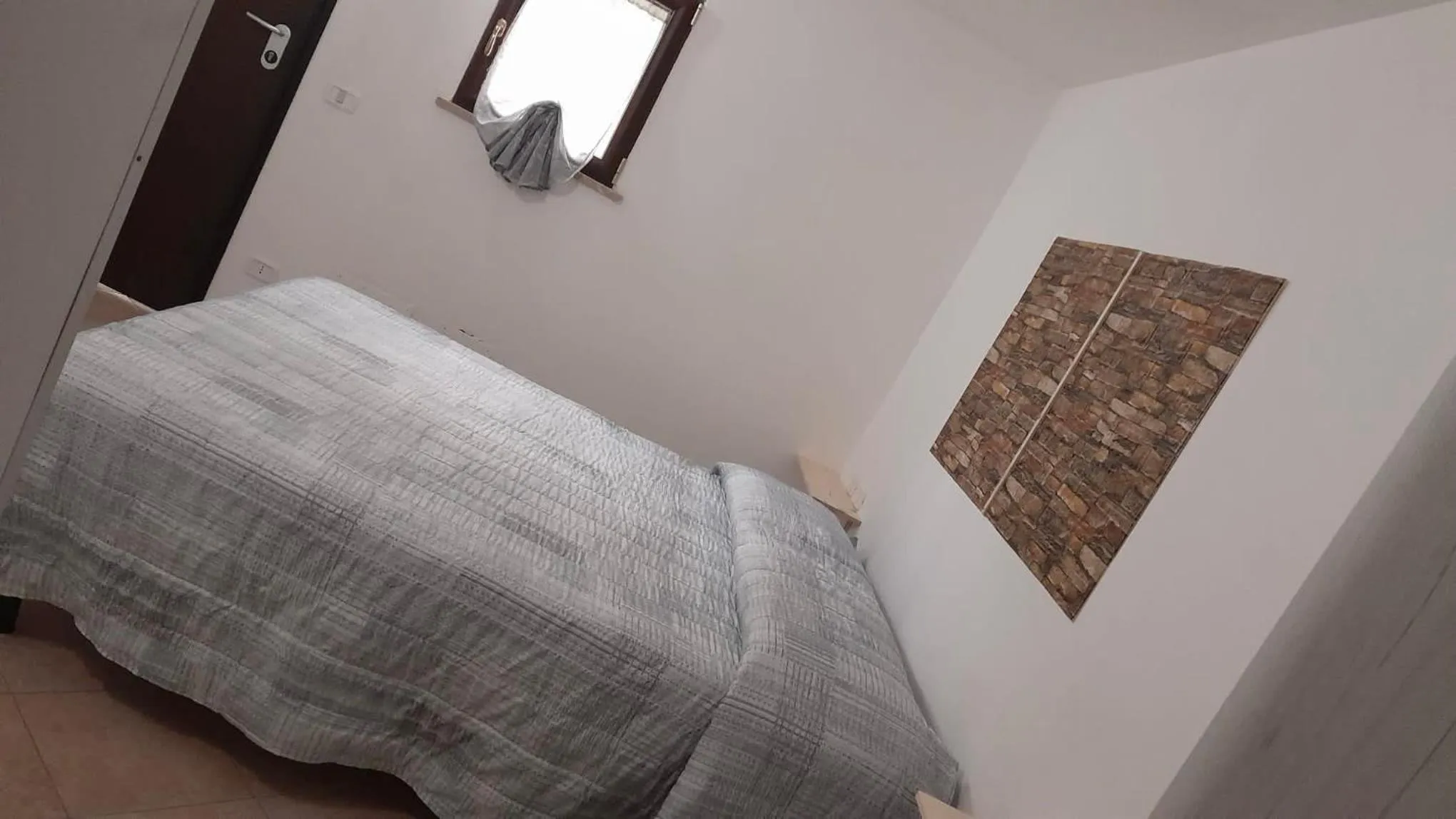 Bed in BeaStella Holiday Rooms