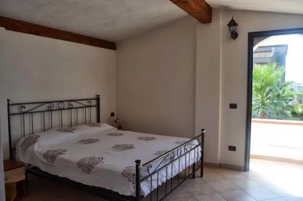 Bed in BeaStella Holiday Rooms