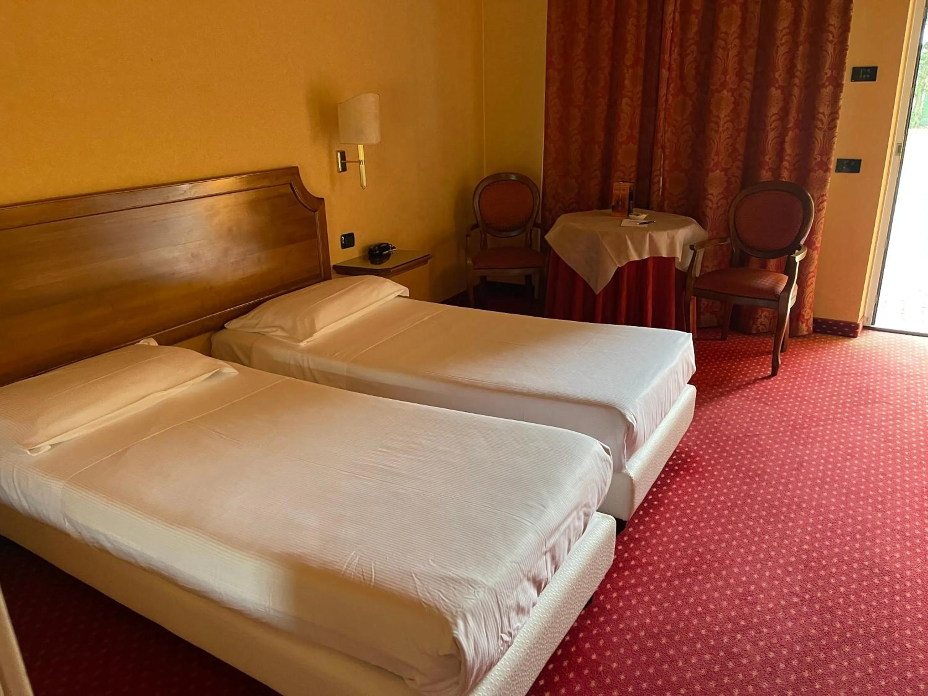 Bed in Hotel Don Carlo