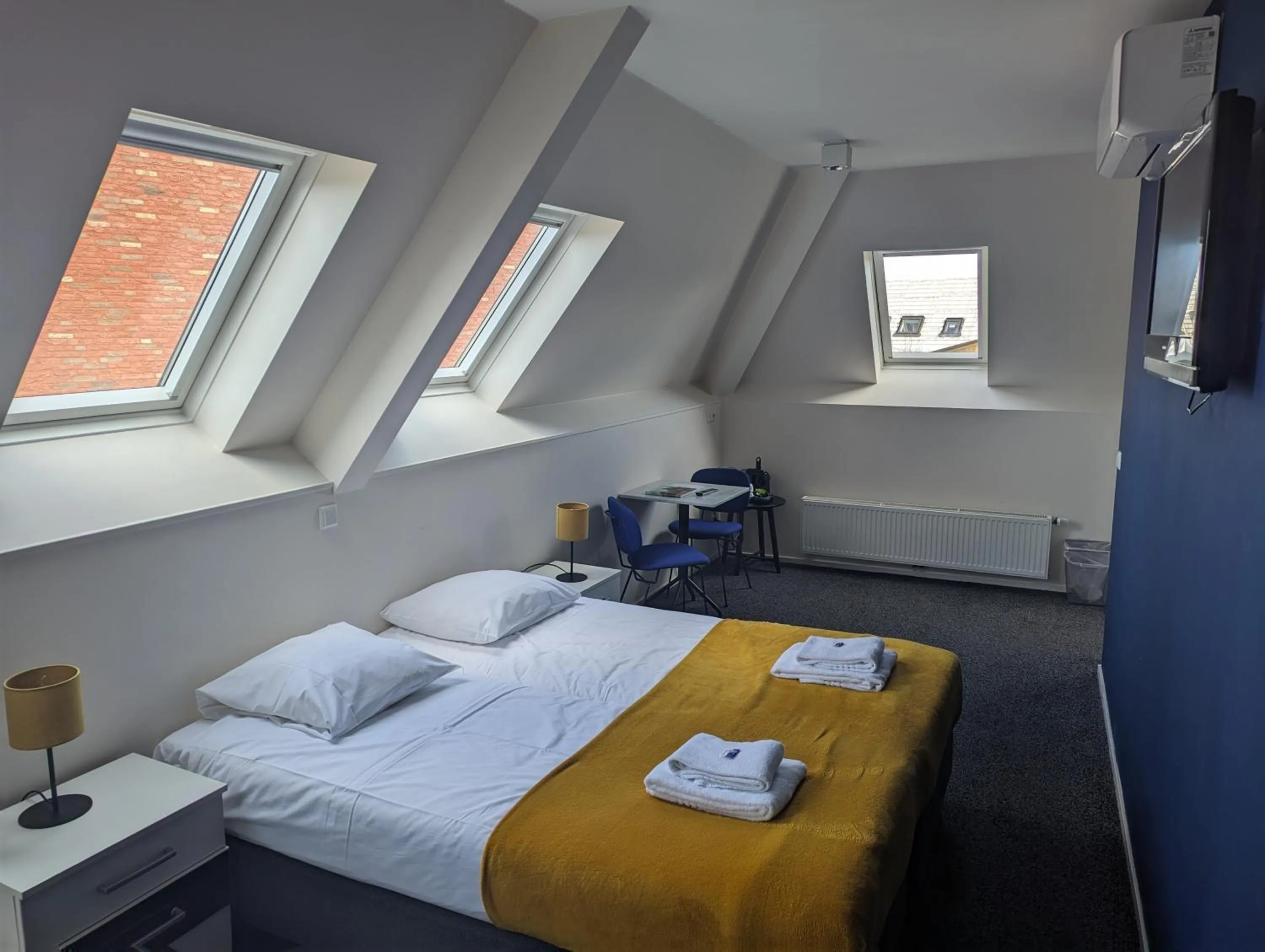 Bed in OTTO Boutique Hotel