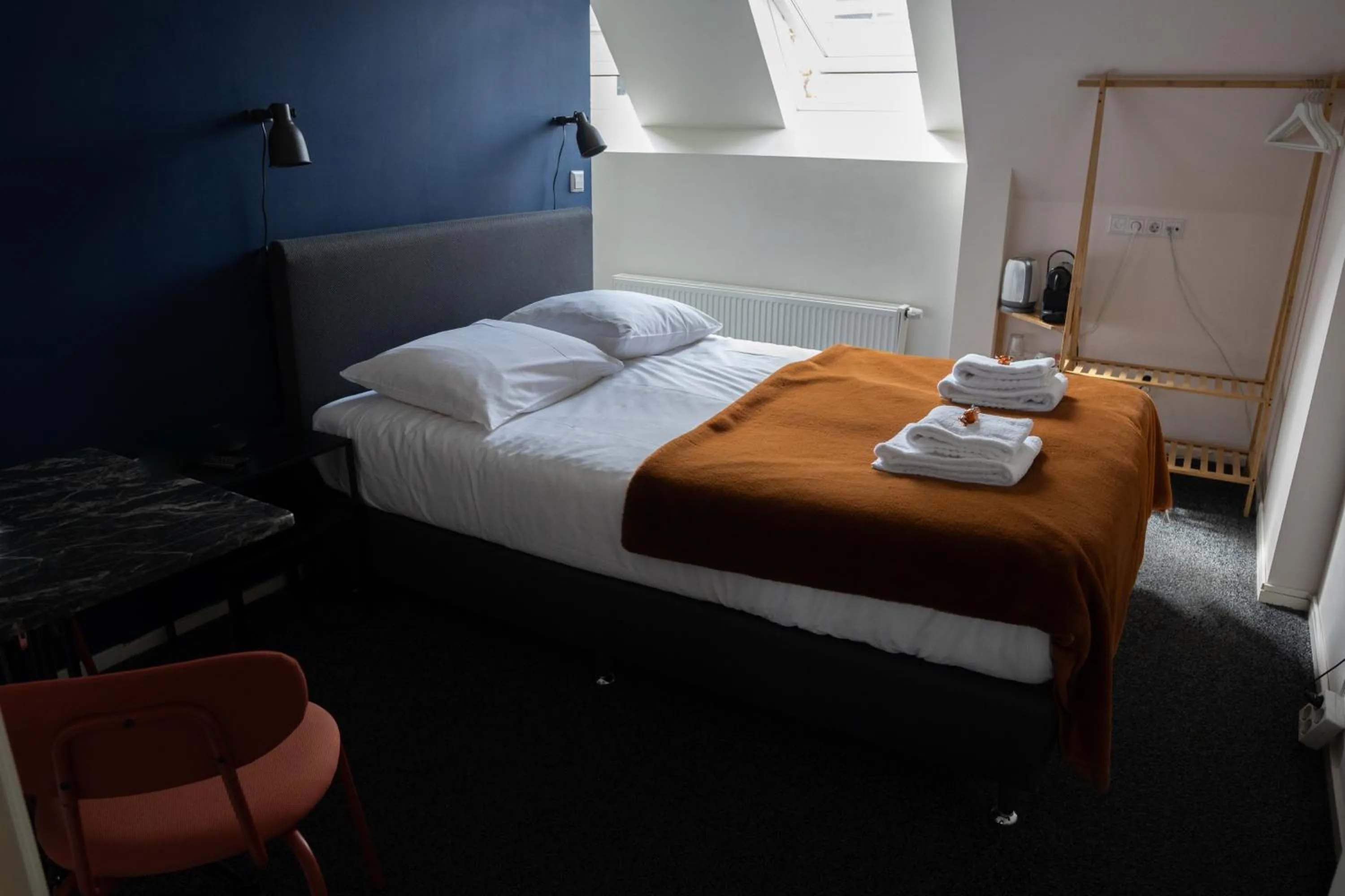 Bed in OTTO Boutique Hotel