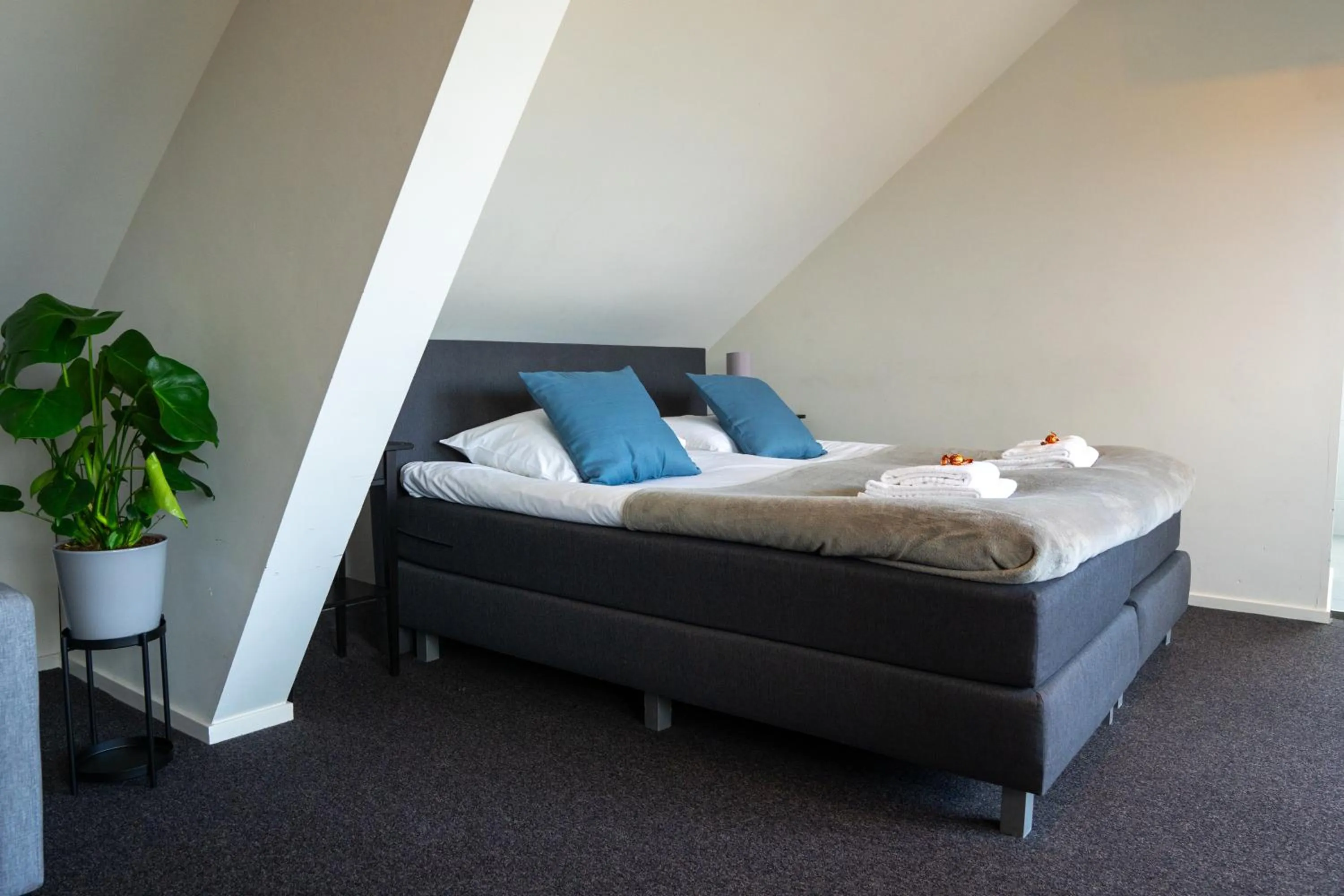 Bed in OTTO Boutique Hotel