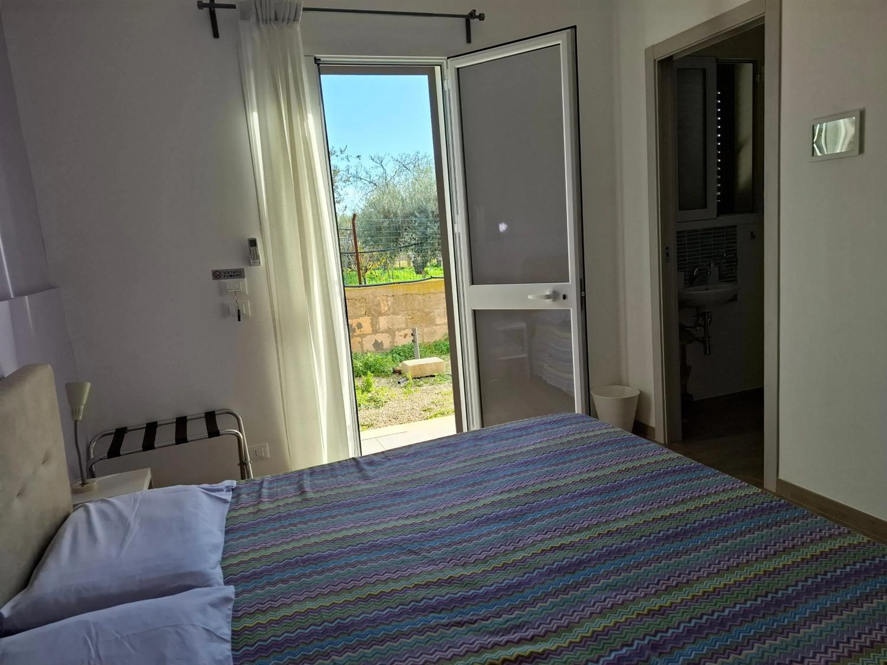 Bed in Turtle Island Apartments