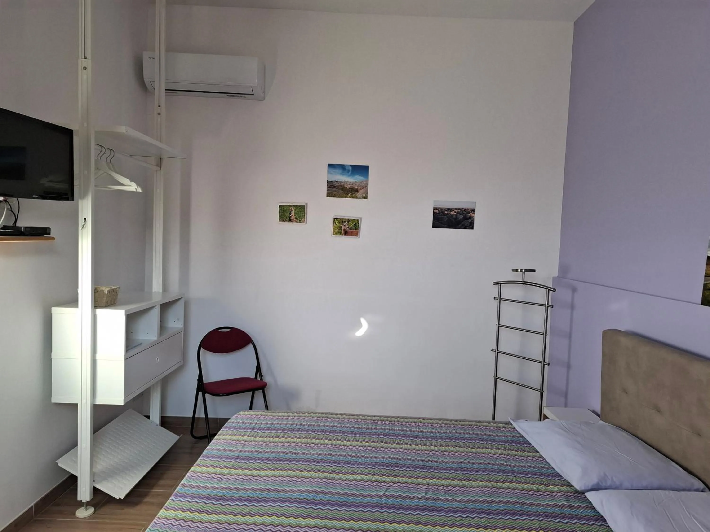 Bed in Turtle Island Apartments