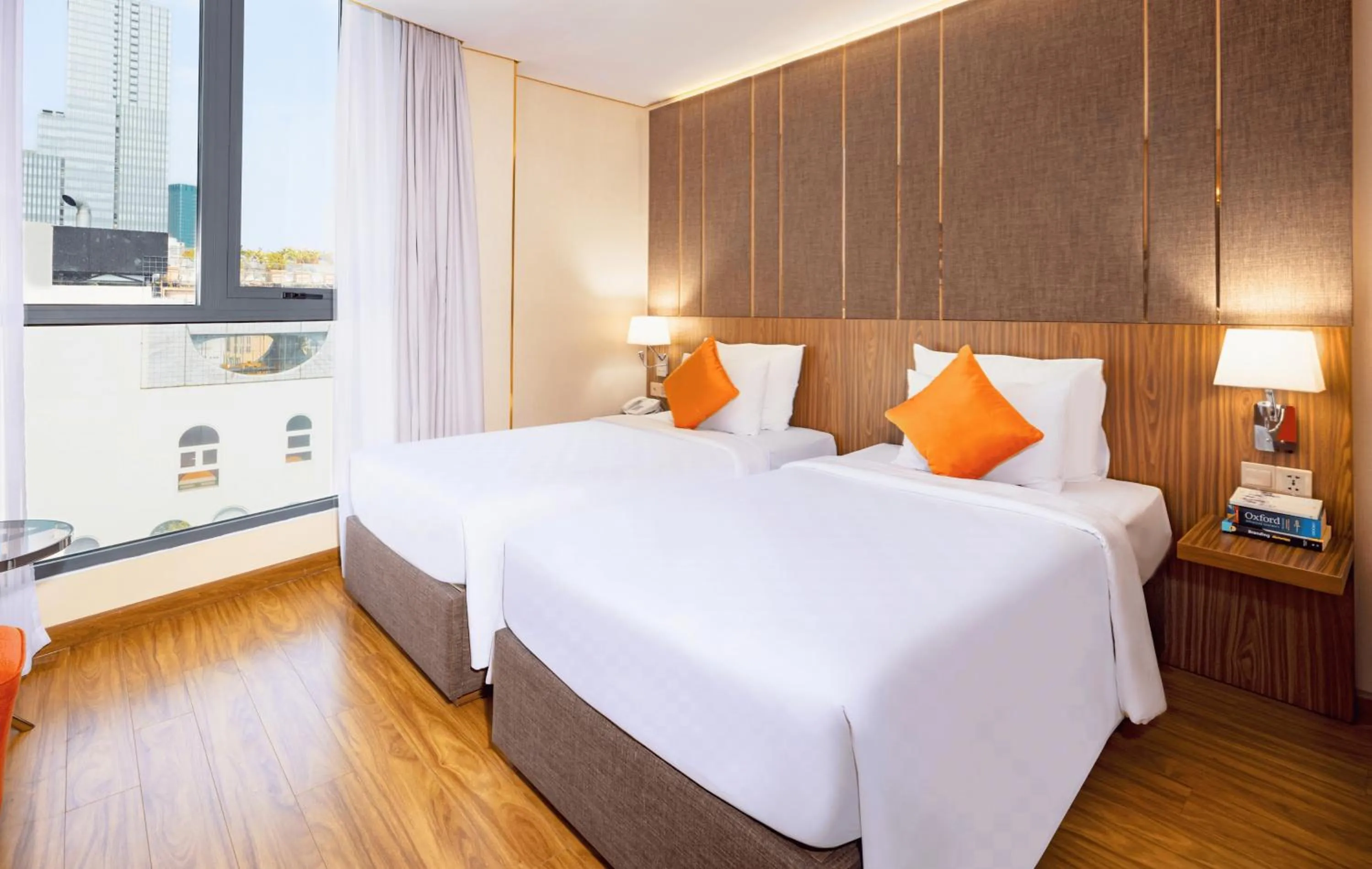 Bed in Winsuites Saigon Hotel