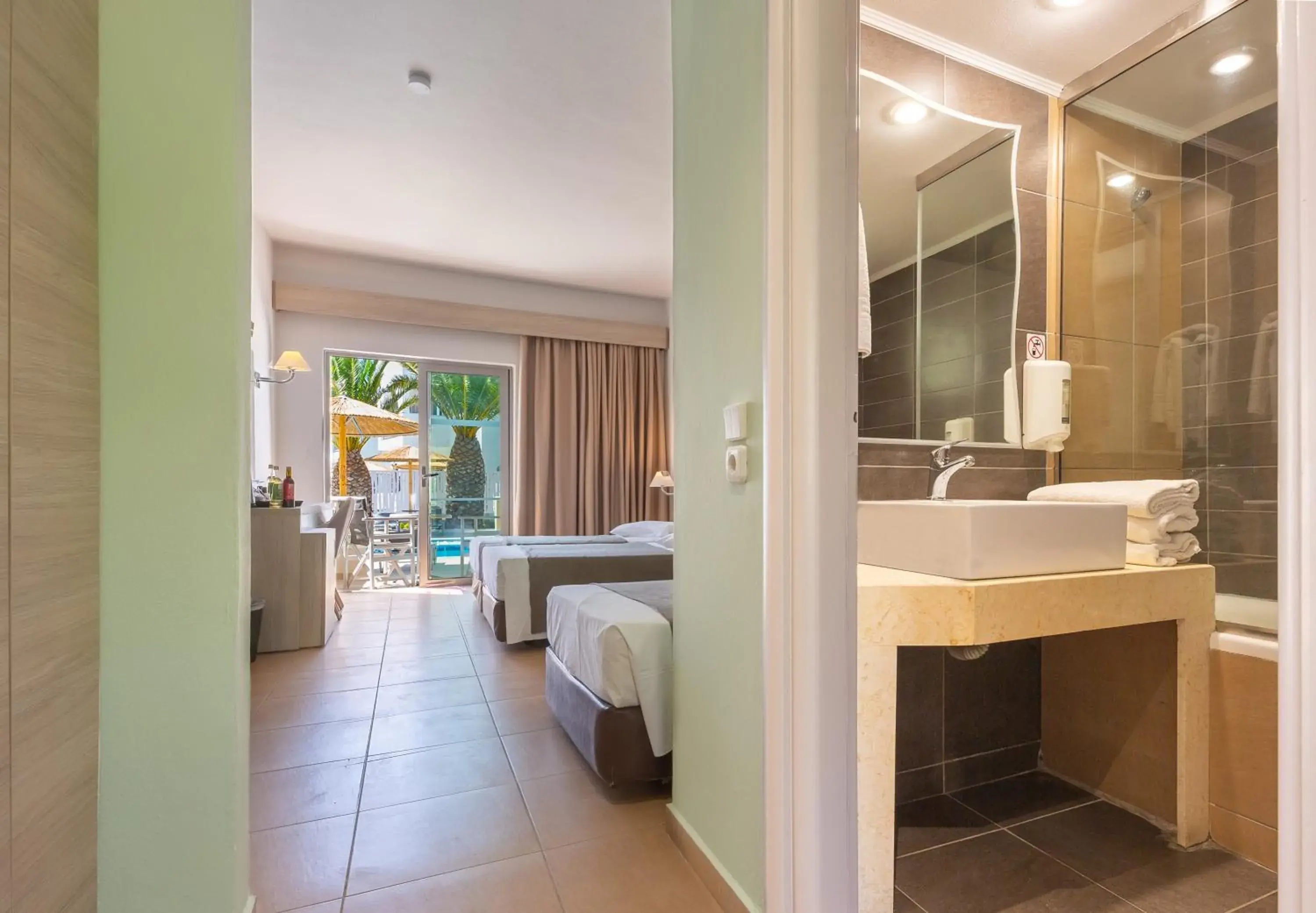 Bathroom, Bed in Akti Beach Club Bathroom, Bed in Akti Beach Club