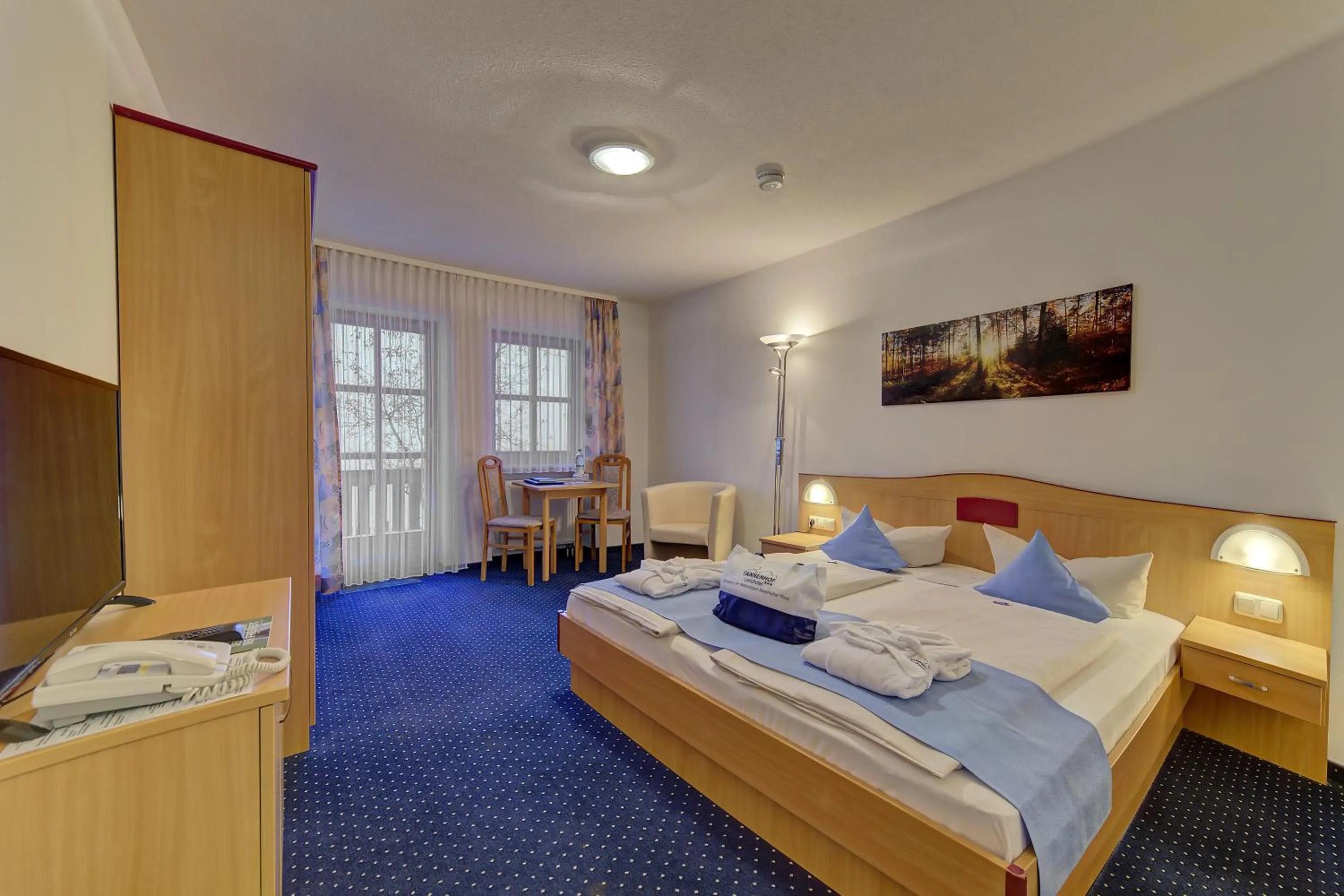 Living room, Bed in Landhotel Tannenhof