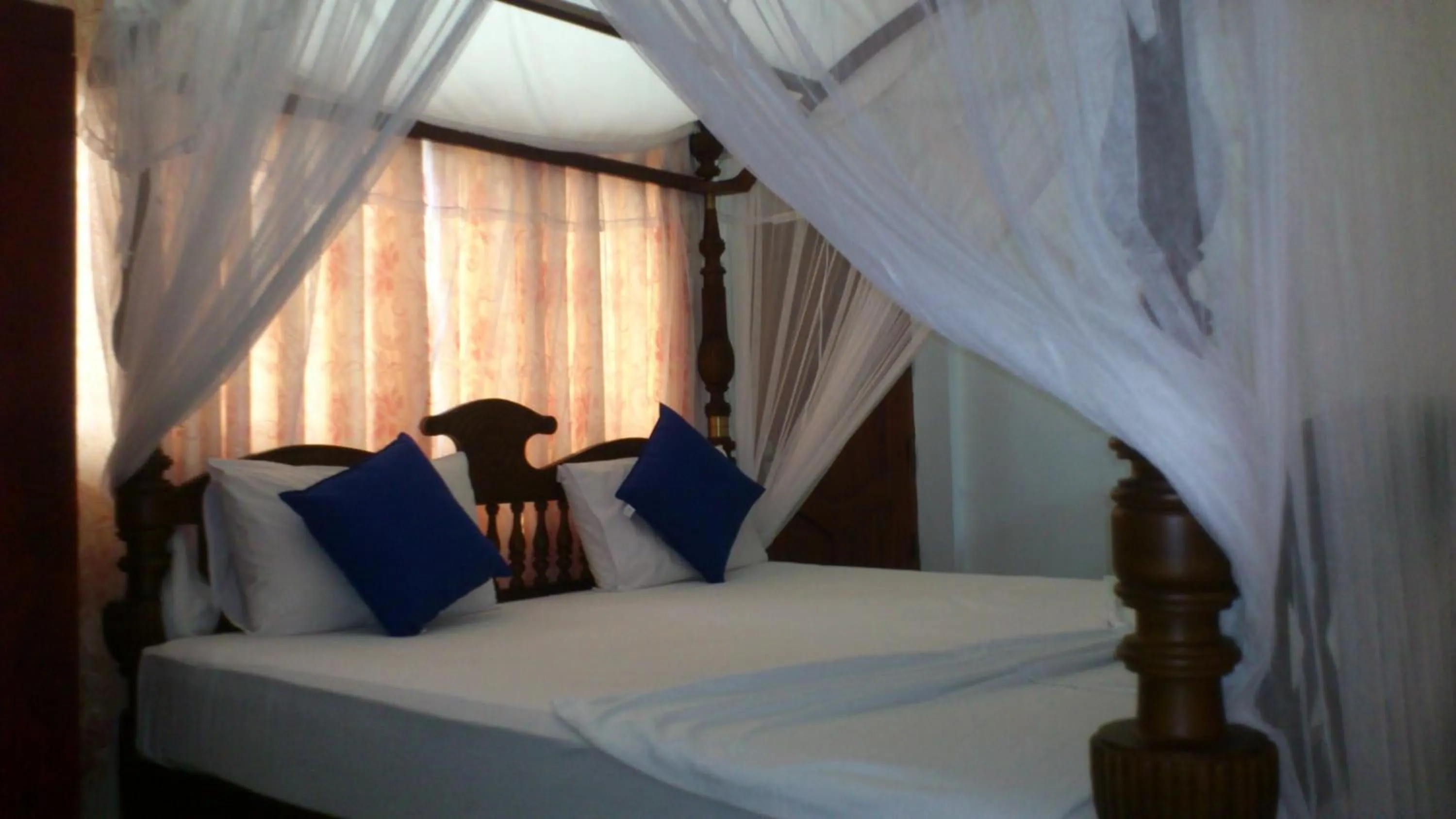 Bed in Ocean View tourist guest house at Negombo beach near the airport
