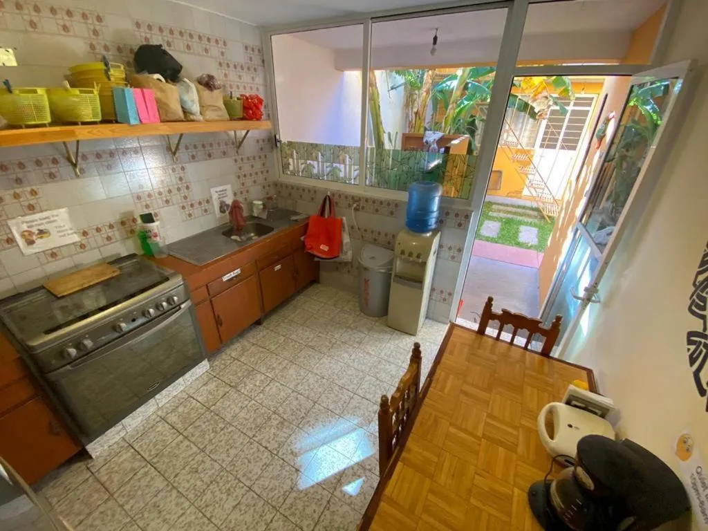 Communal kitchen in Los Nardos Hostel -pet friendly-