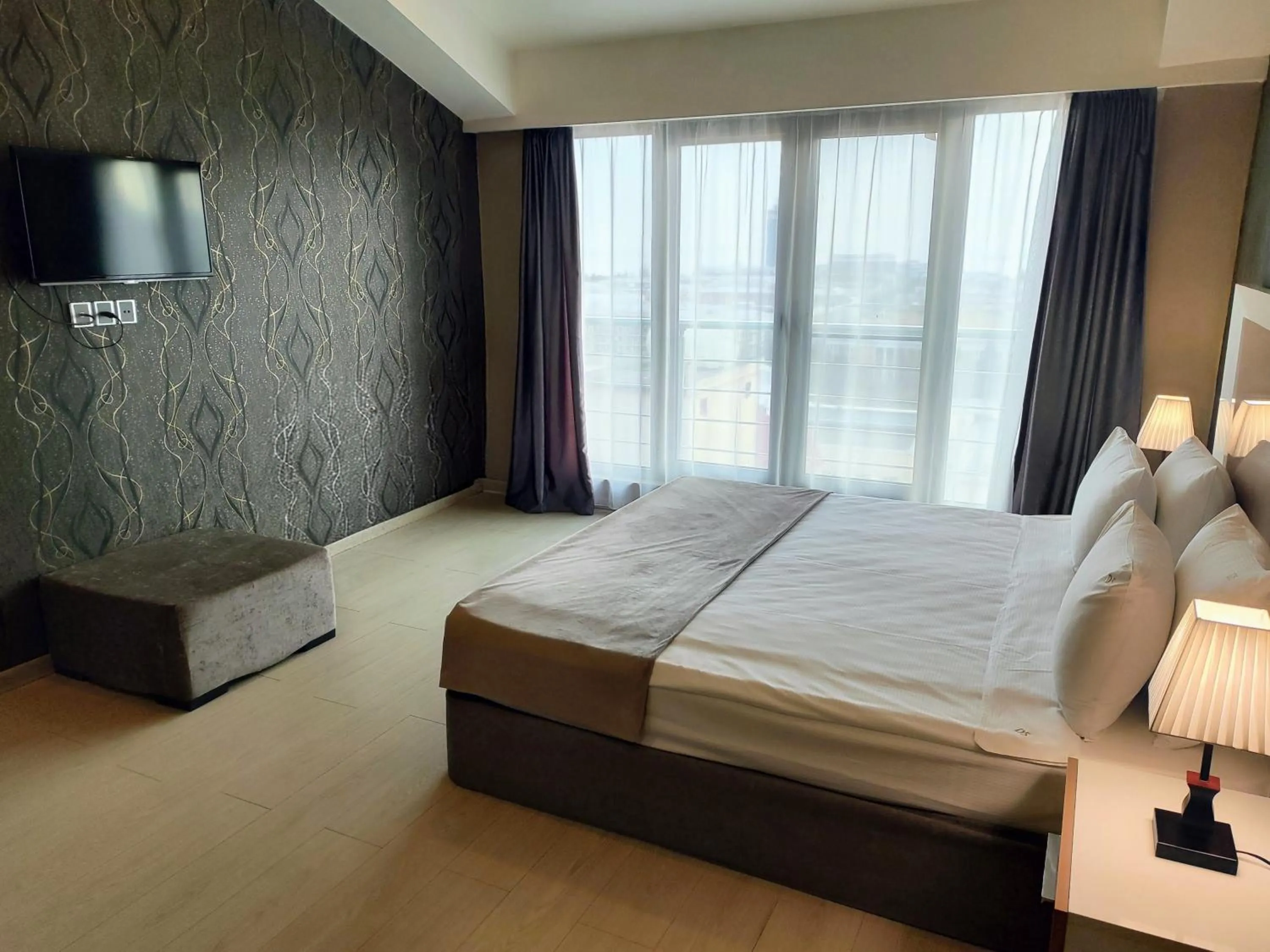 Bed in Diplomat Suites Hotel