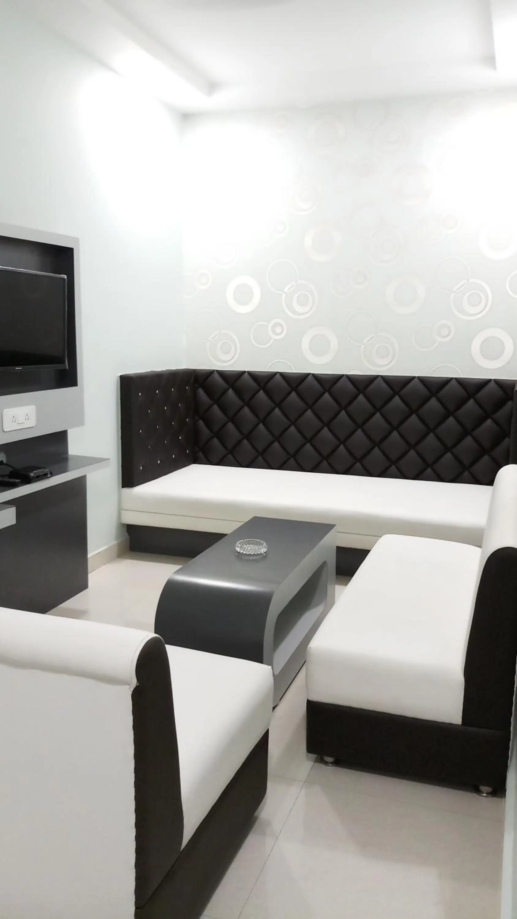 Seating area, Bed in Hotel Saayein Residency