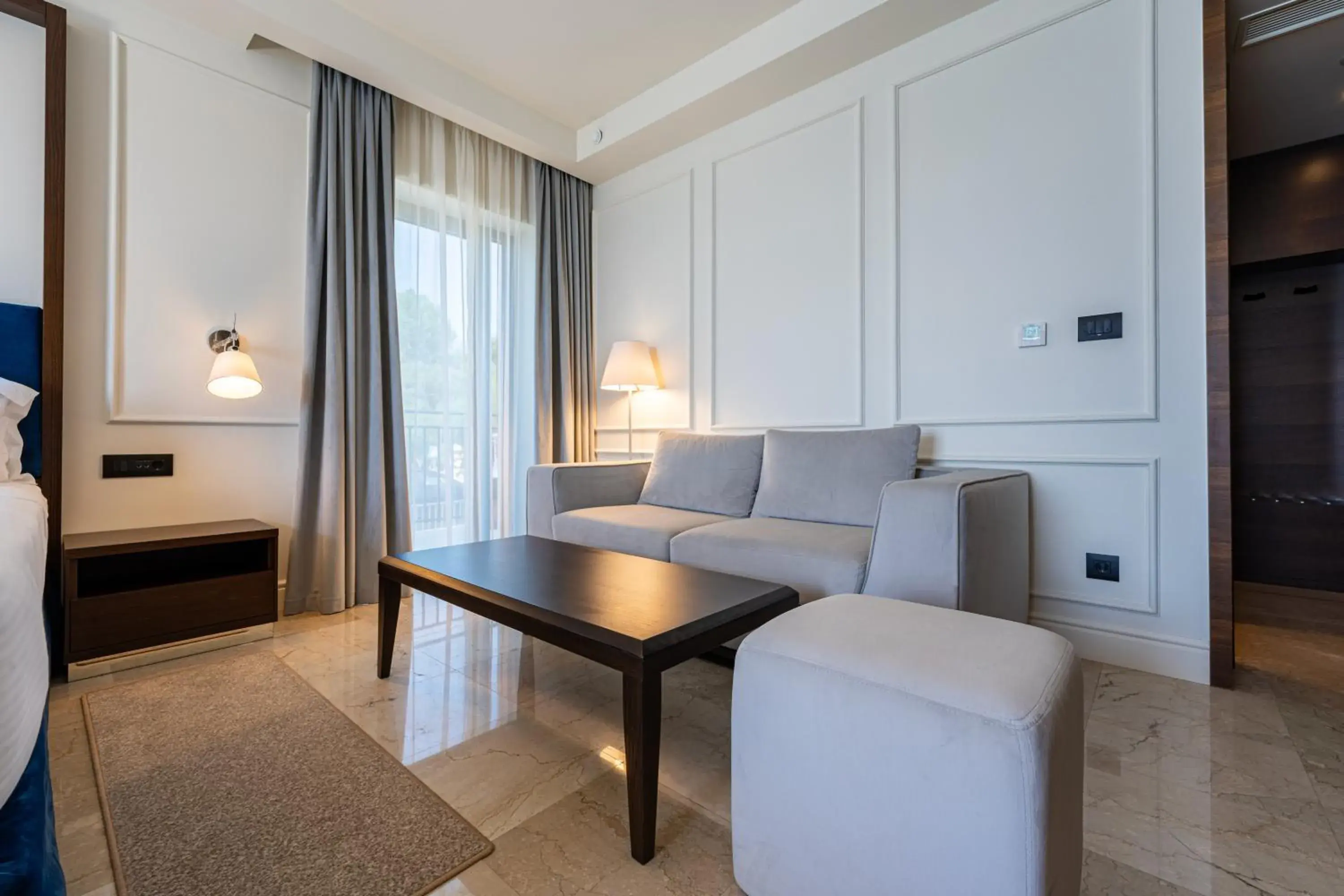 Seating area, Bed in Hotel California by Aycon Seating area, Bed in Hotel California by Aycon