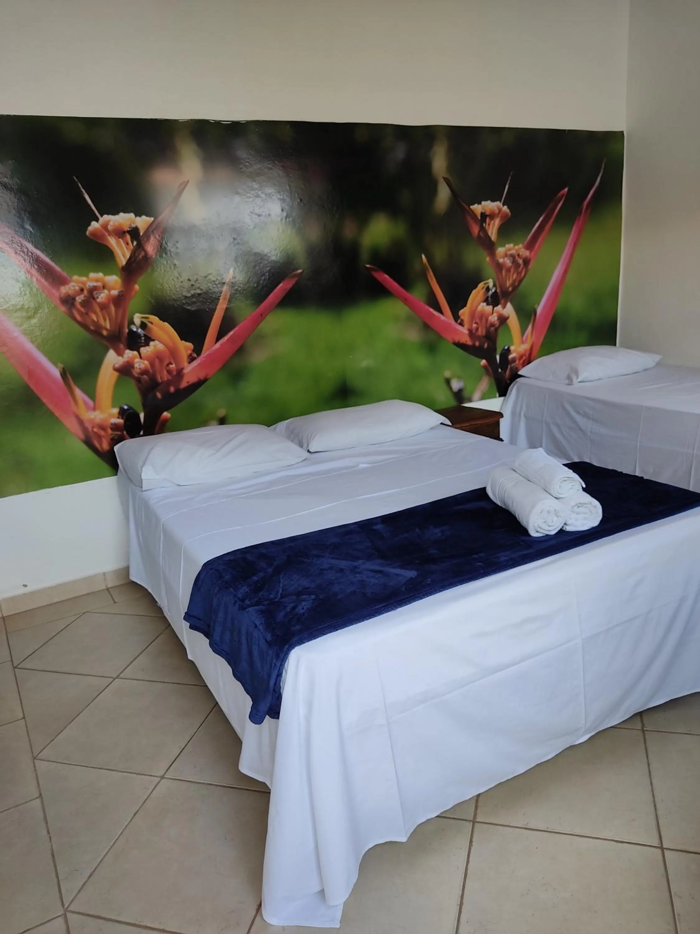 Bed in Pousada Colonial