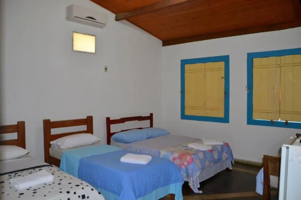Bed in Pousada Colonial