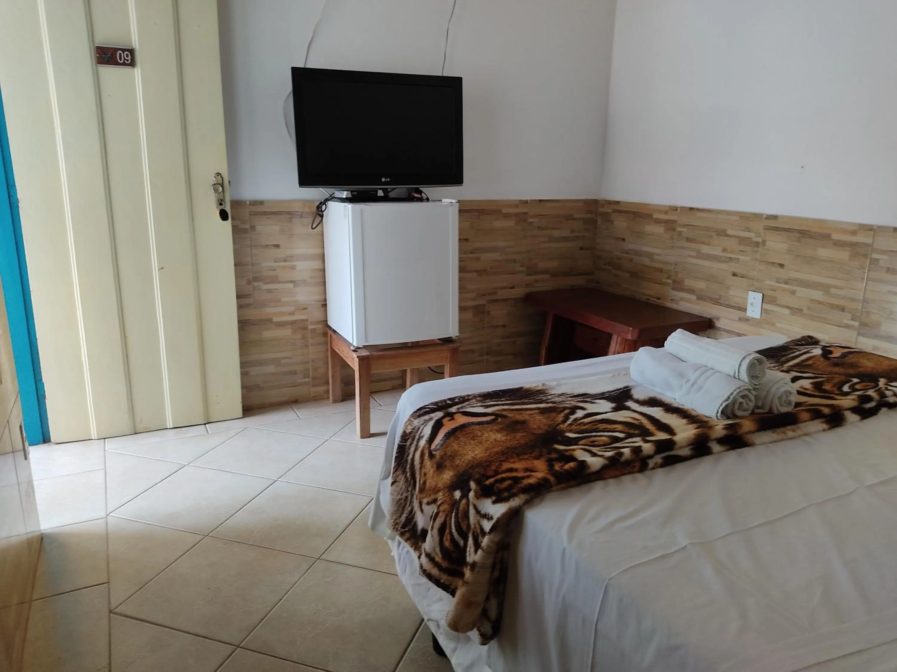 Bed in Pousada Colonial