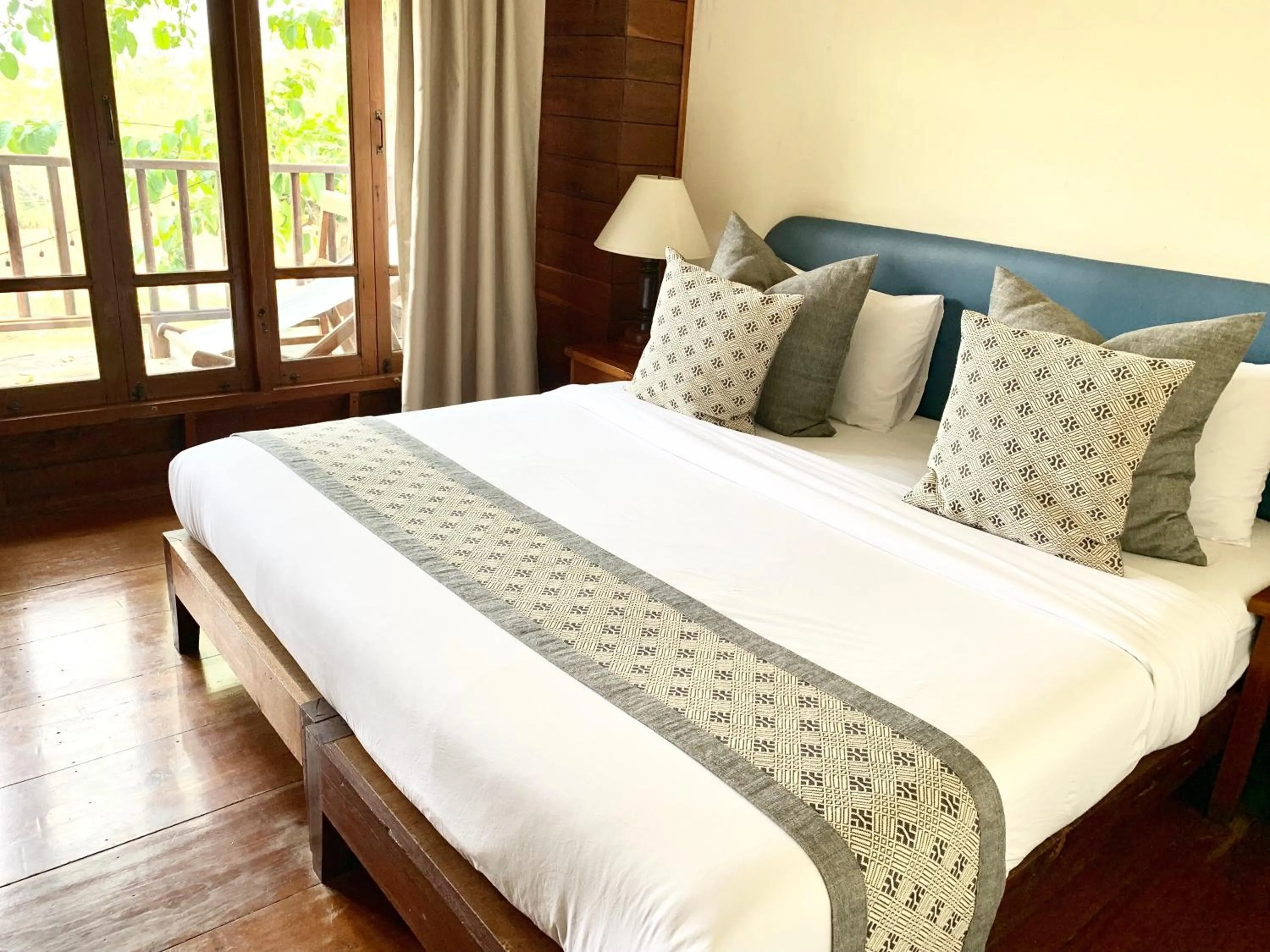 Bed in Riverhouse-The Teak House