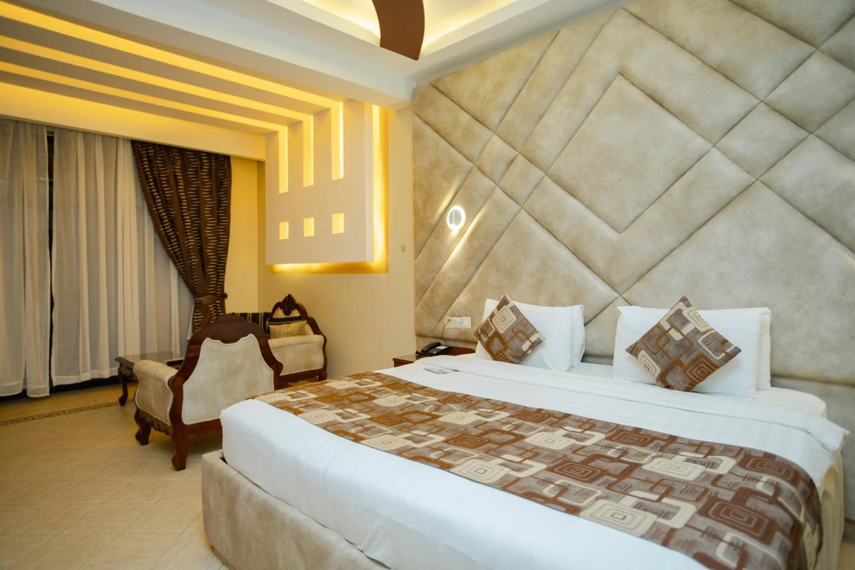 Bed in Malaika Beach Resort