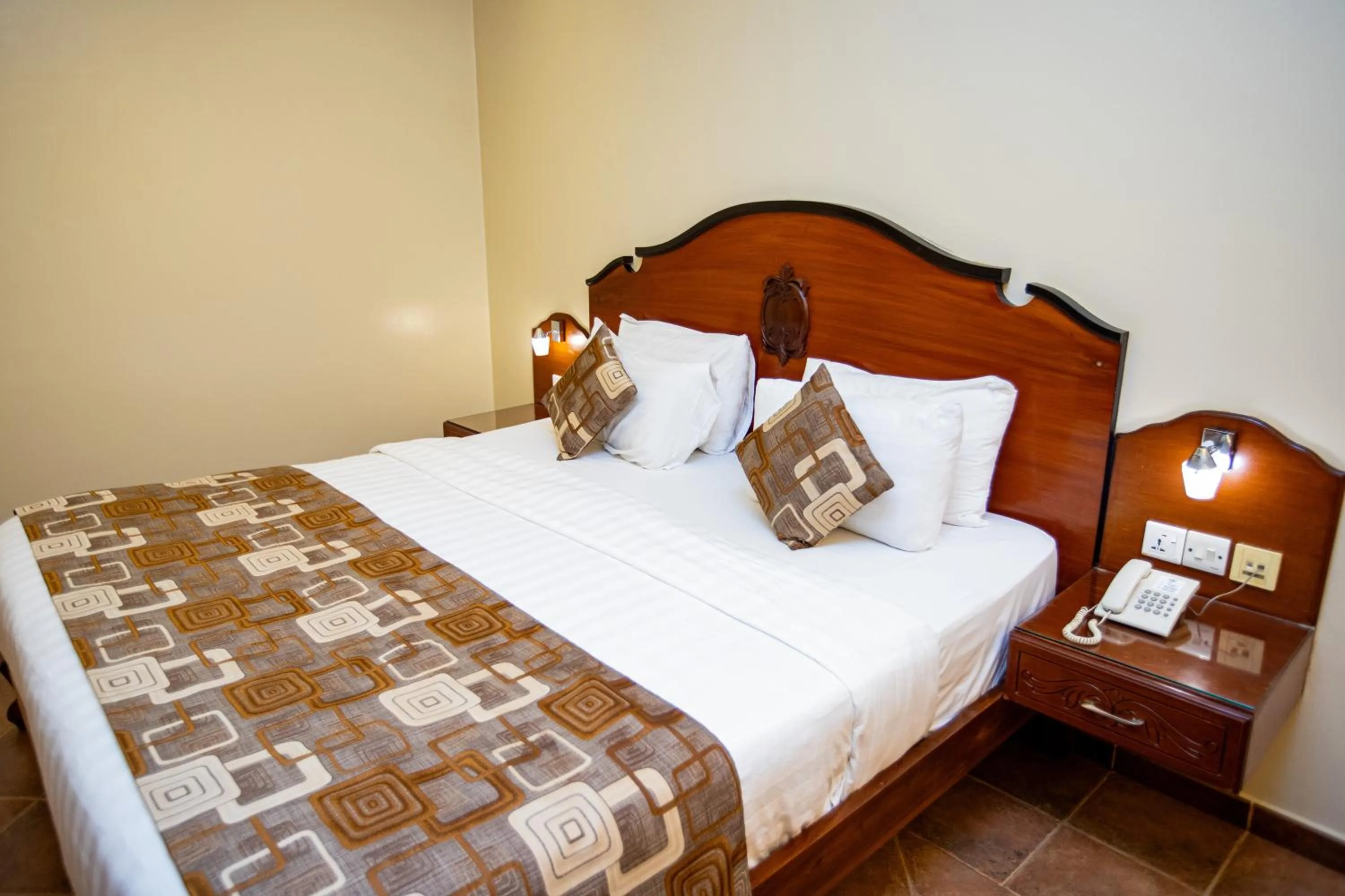 Bed in Malaika Beach Resort