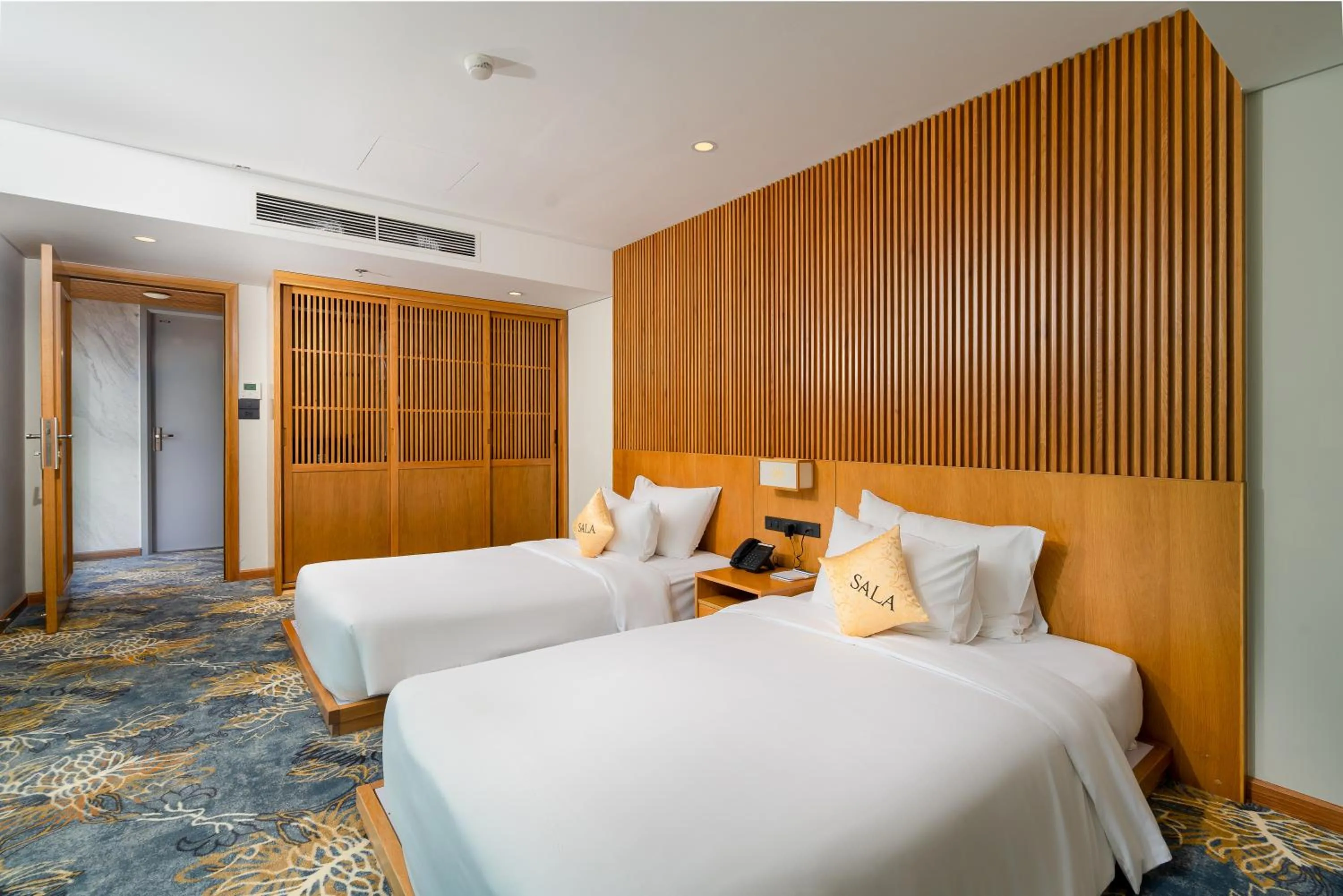 Bed in Sala Danang Beach Hotel