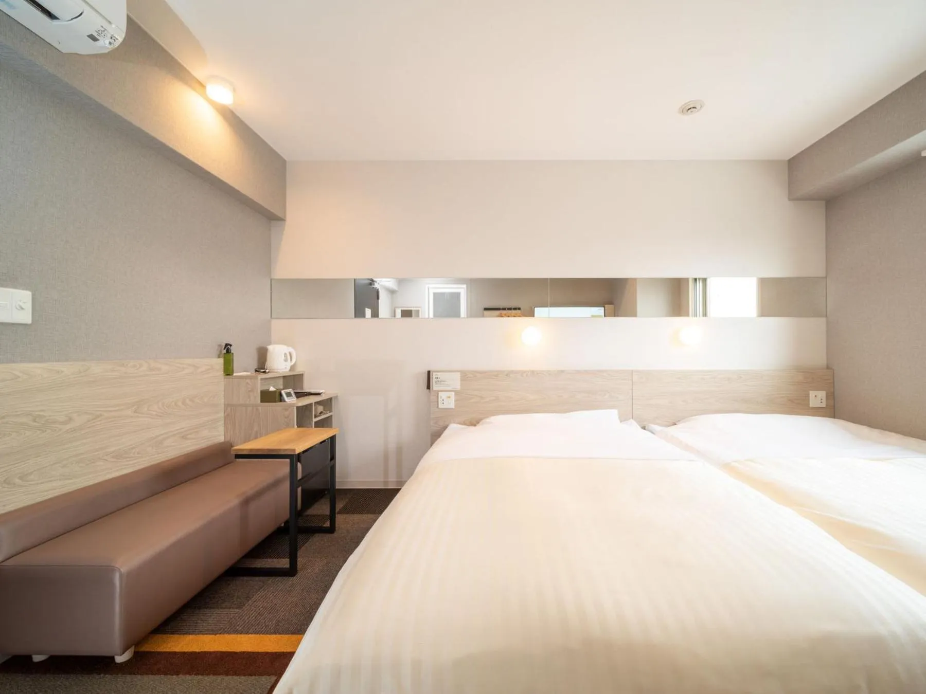 Bed in Super Hotel Premier Obihiro Ekimae