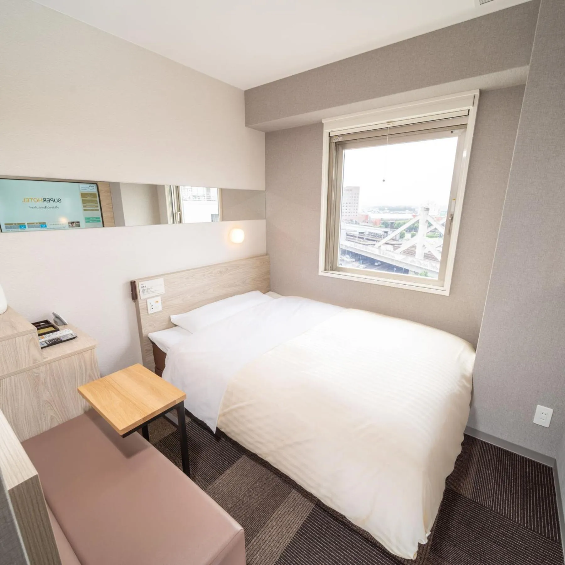 Bed in Super Hotel Premier Obihiro Ekimae