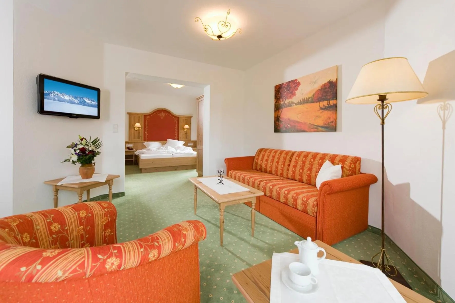 Living room, Bed in Landhotel Föhrenhof Ellmau