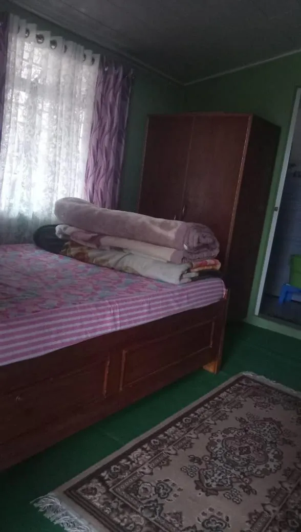 Bed in Sanjeema Tea Estate Homestay