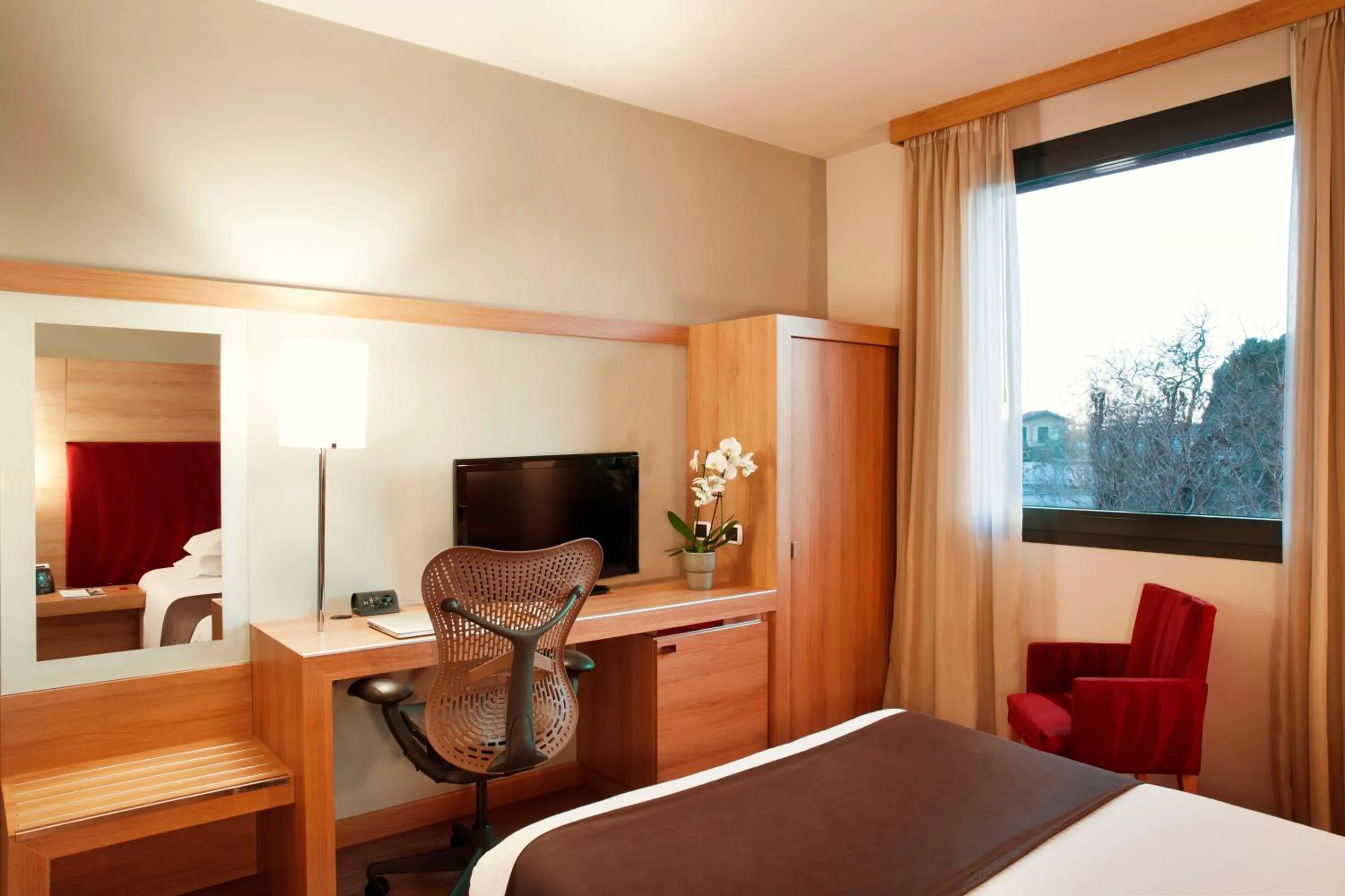 Bed in Zeus Essence Dolce by Wyndham Milan Malpensa