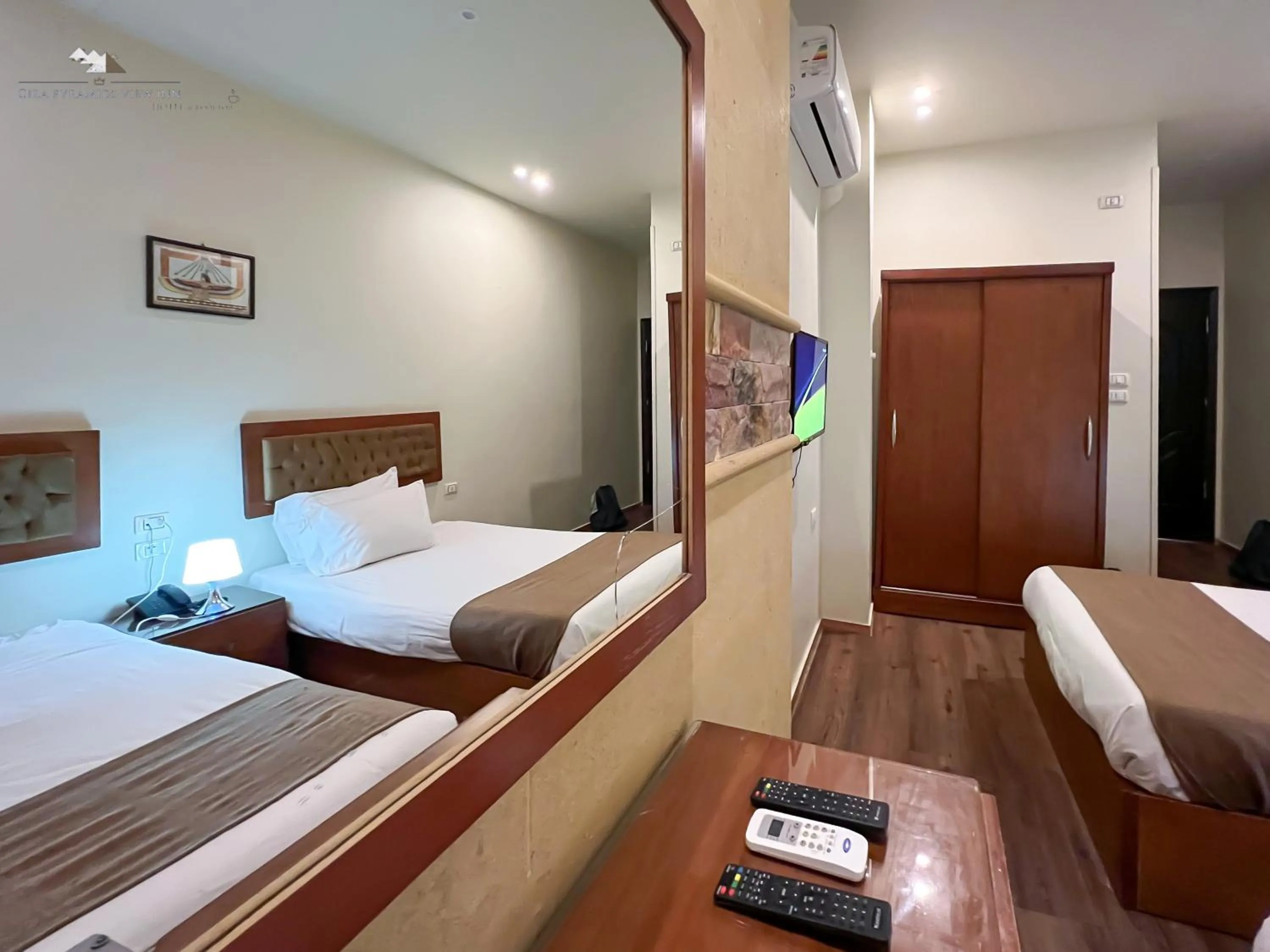 Communal lounge/ TV room, Bed in Giza Pyramids View Inn