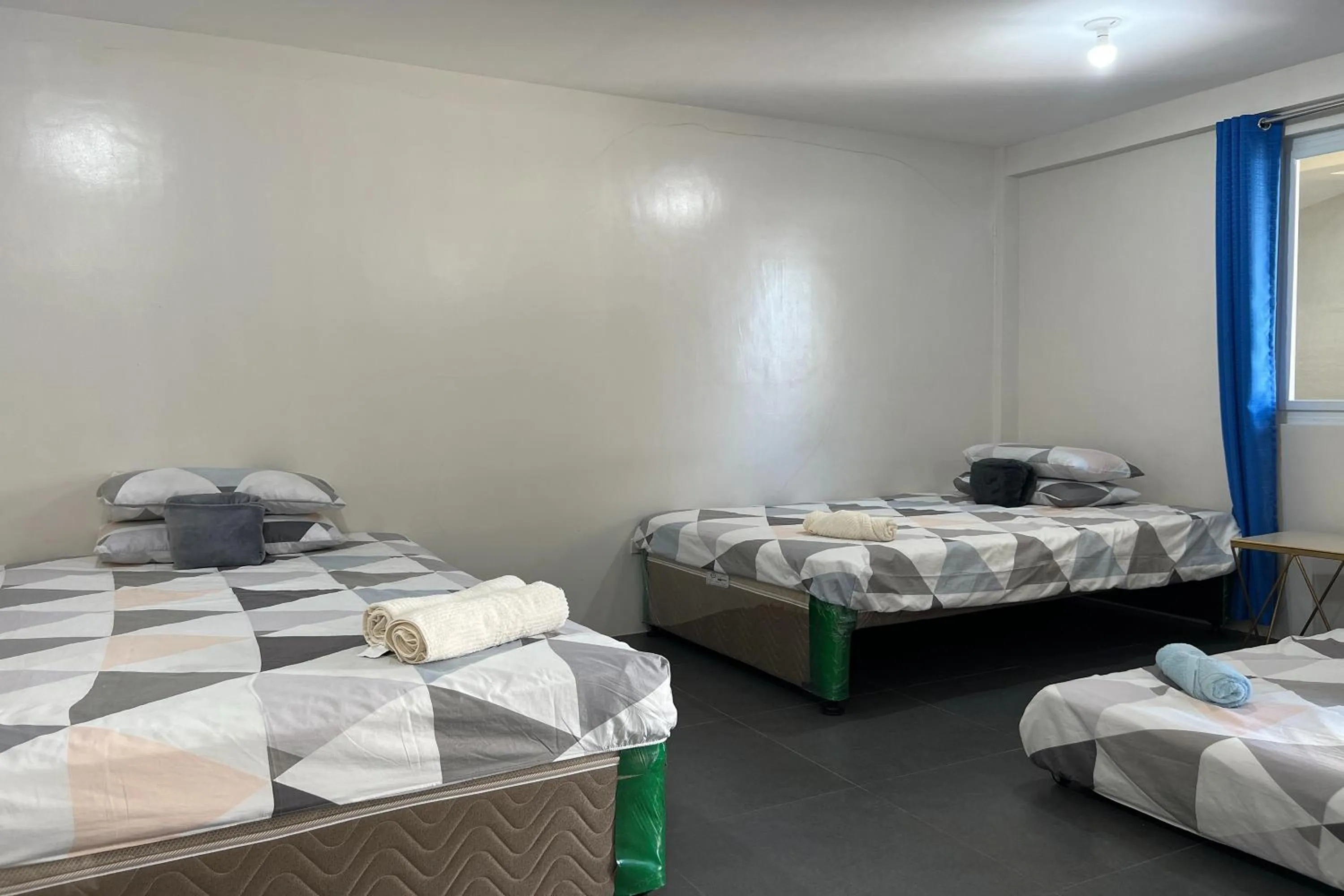 Bed in Happy Grey Hotel Vigan