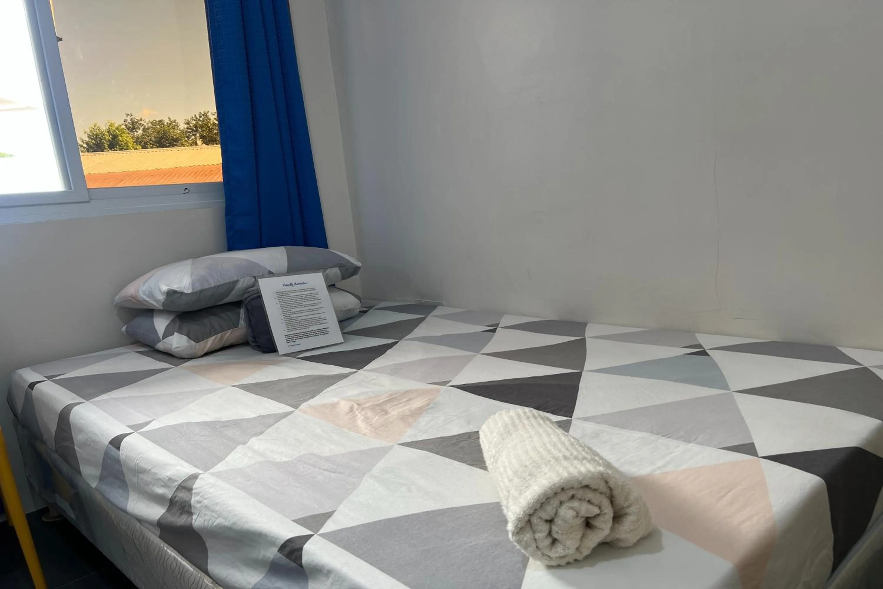 Bed in Happy Grey Hotel Vigan