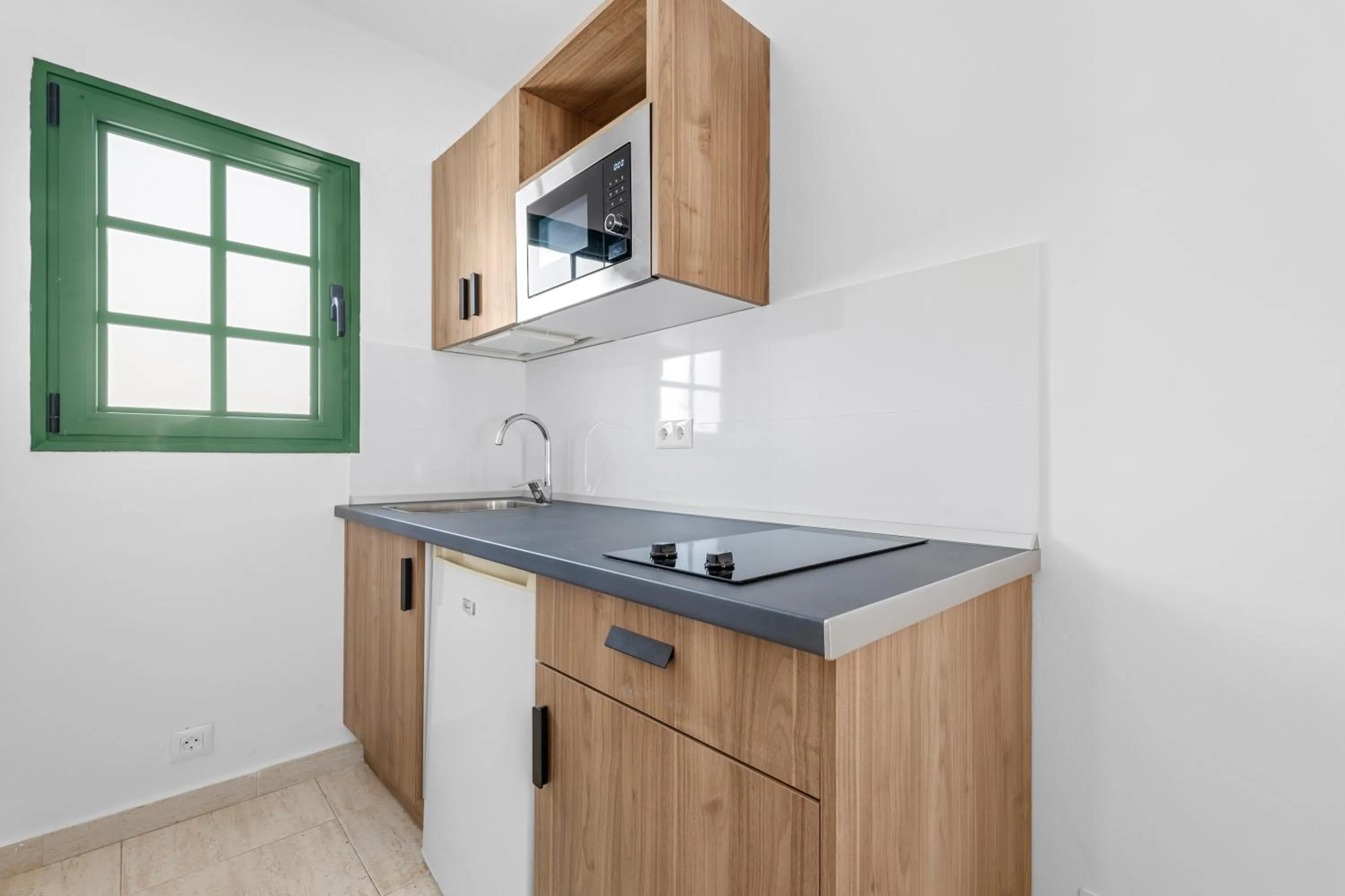 Kitchen or kitchenette in Apartamentos Tropicana