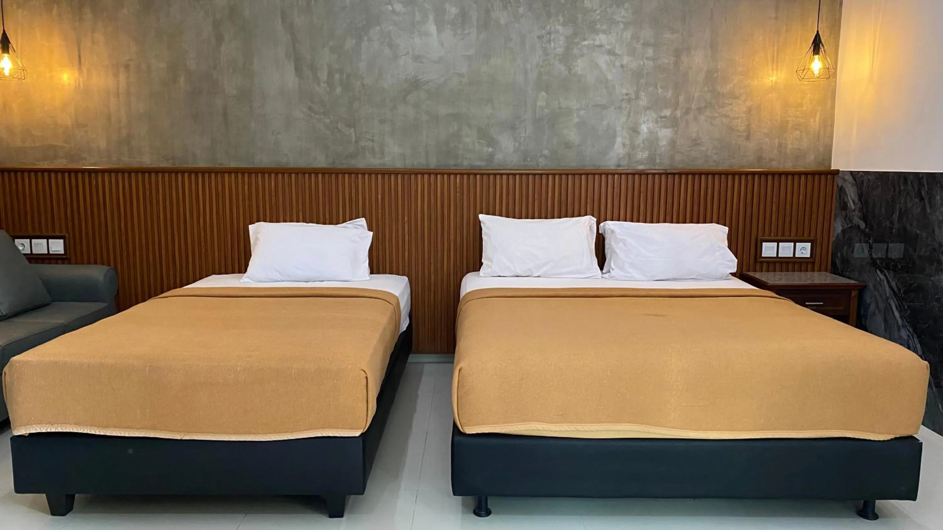 Bed in Sandat Hotel Legian