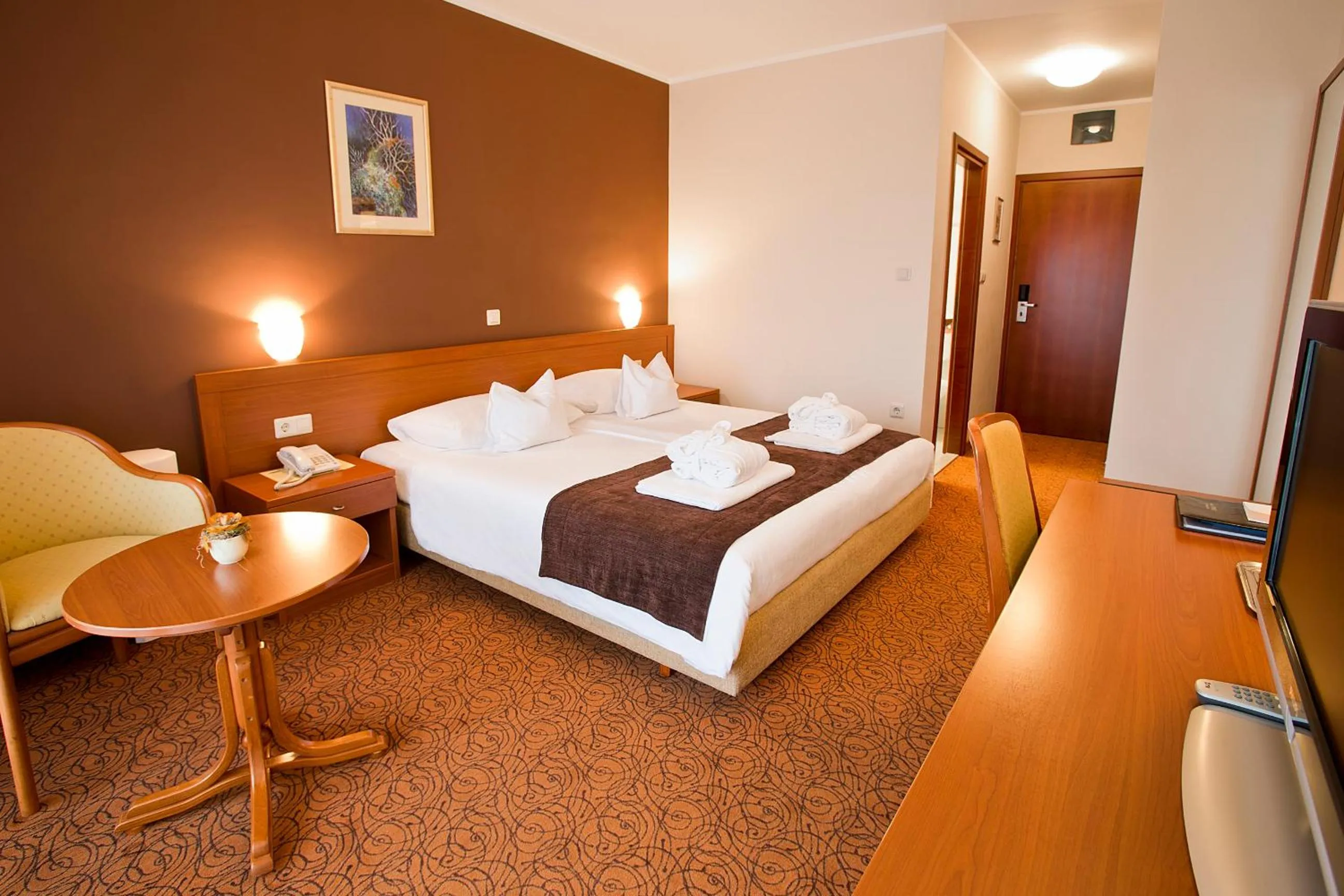 Bed in Spa & Wellness Hotel Pinia