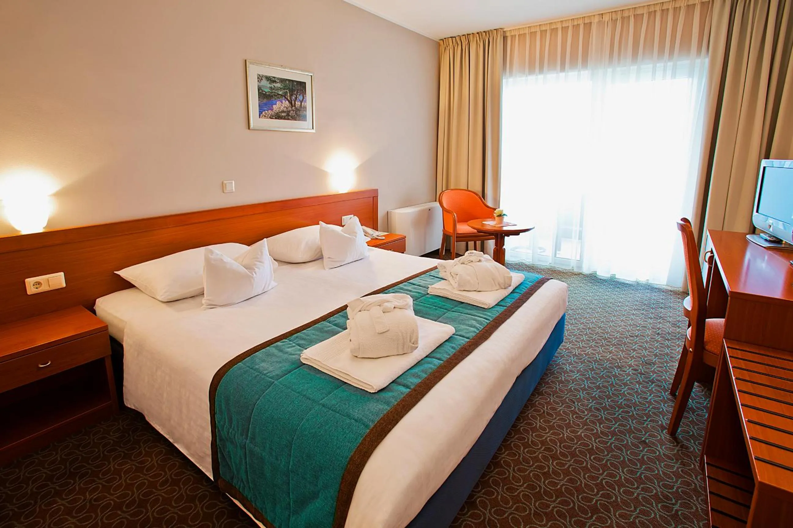 Bed in Spa & Wellness Hotel Pinia