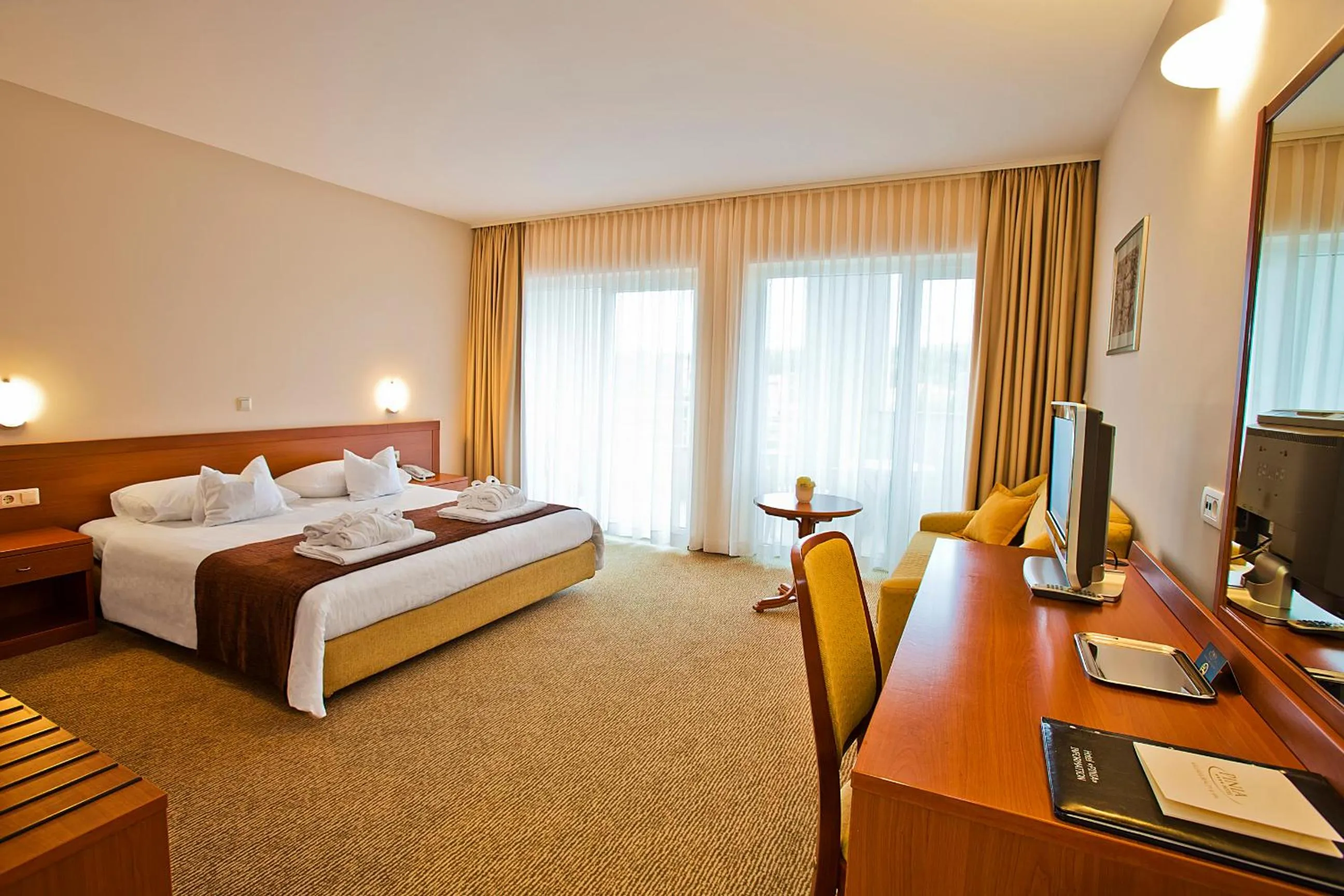 Bed in Spa & Wellness Hotel Pinia
