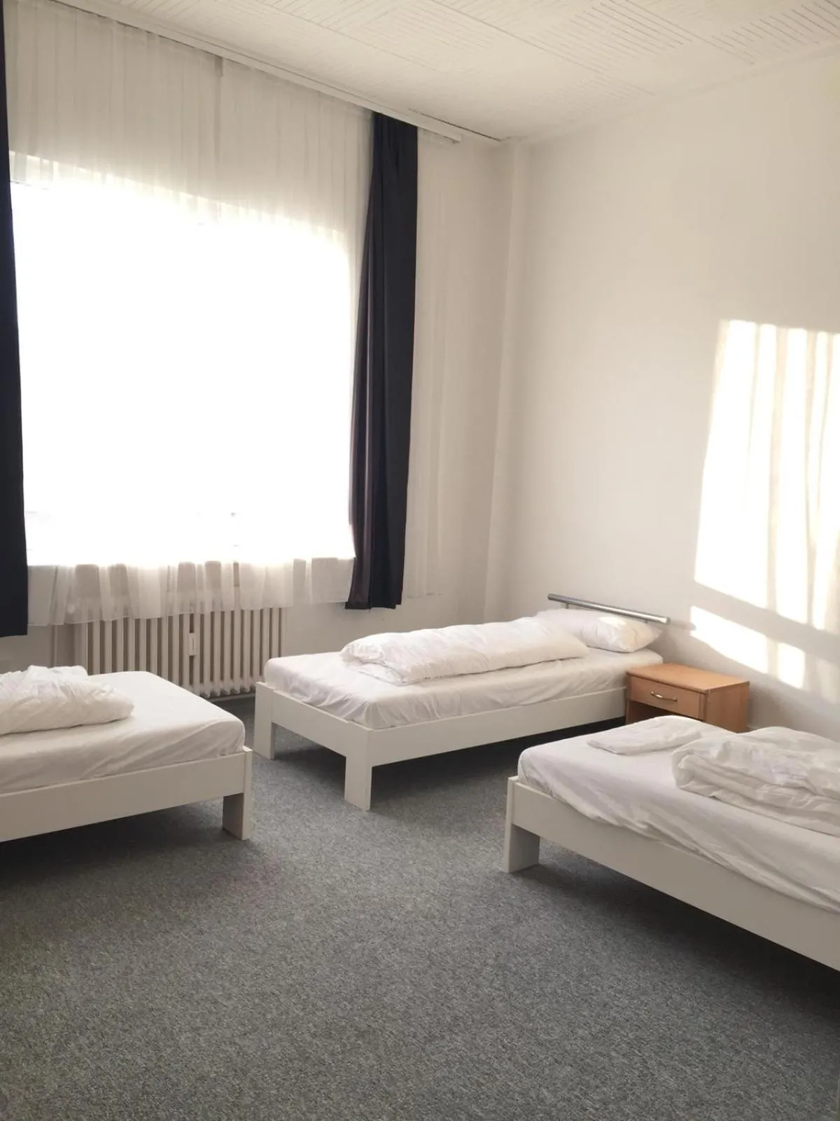 Photo of the whole room, Bed in Pension Dreilinden Hannover GmbH
