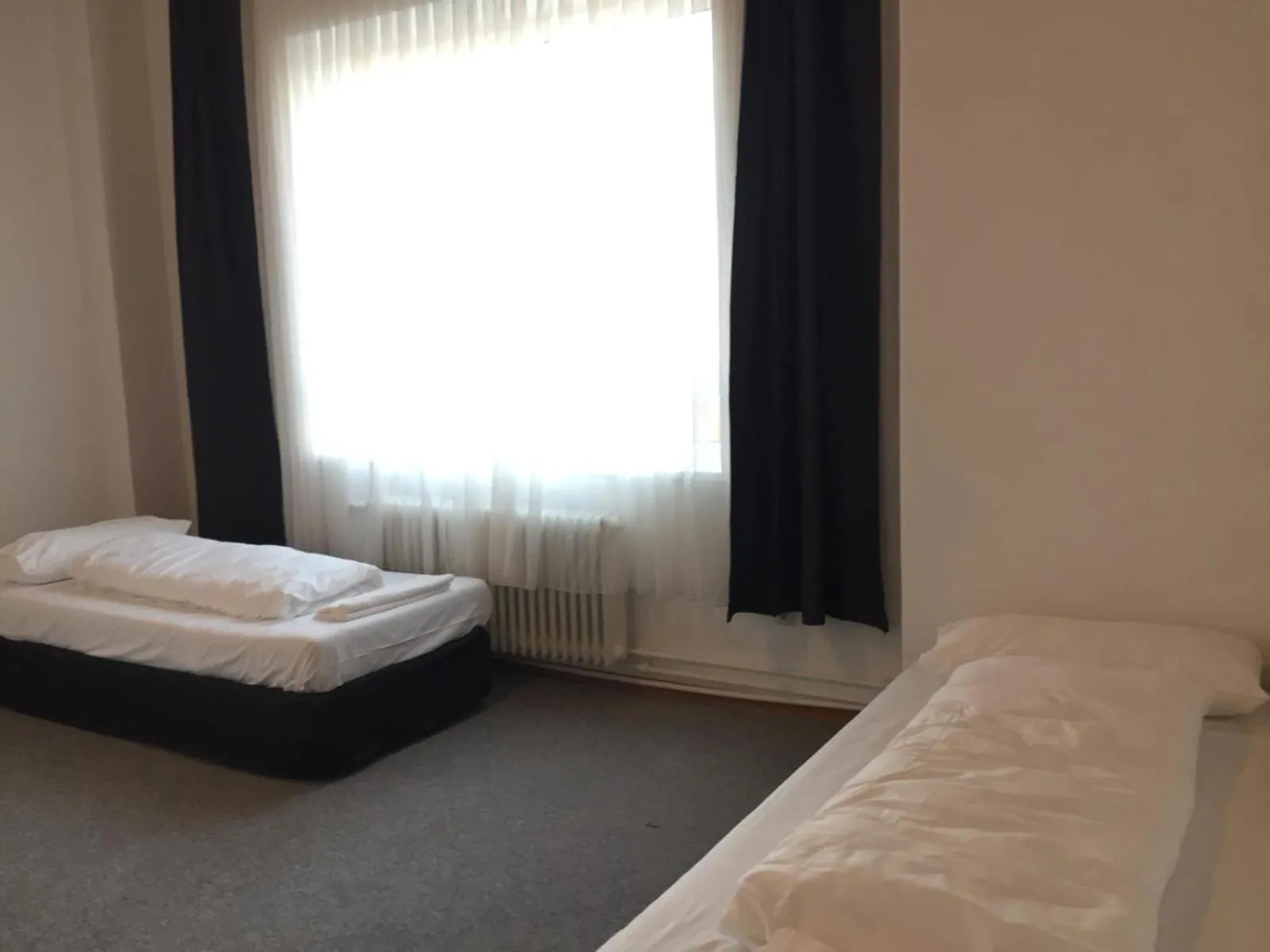 Photo of the whole room, Bed in Pension Dreilinden Hannover GmbH