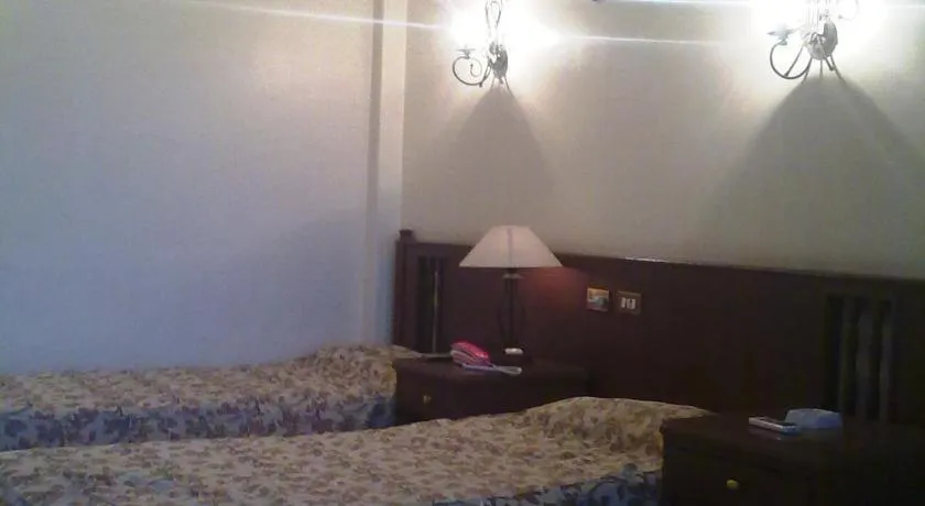 Bed in Orchida St. George Hotel