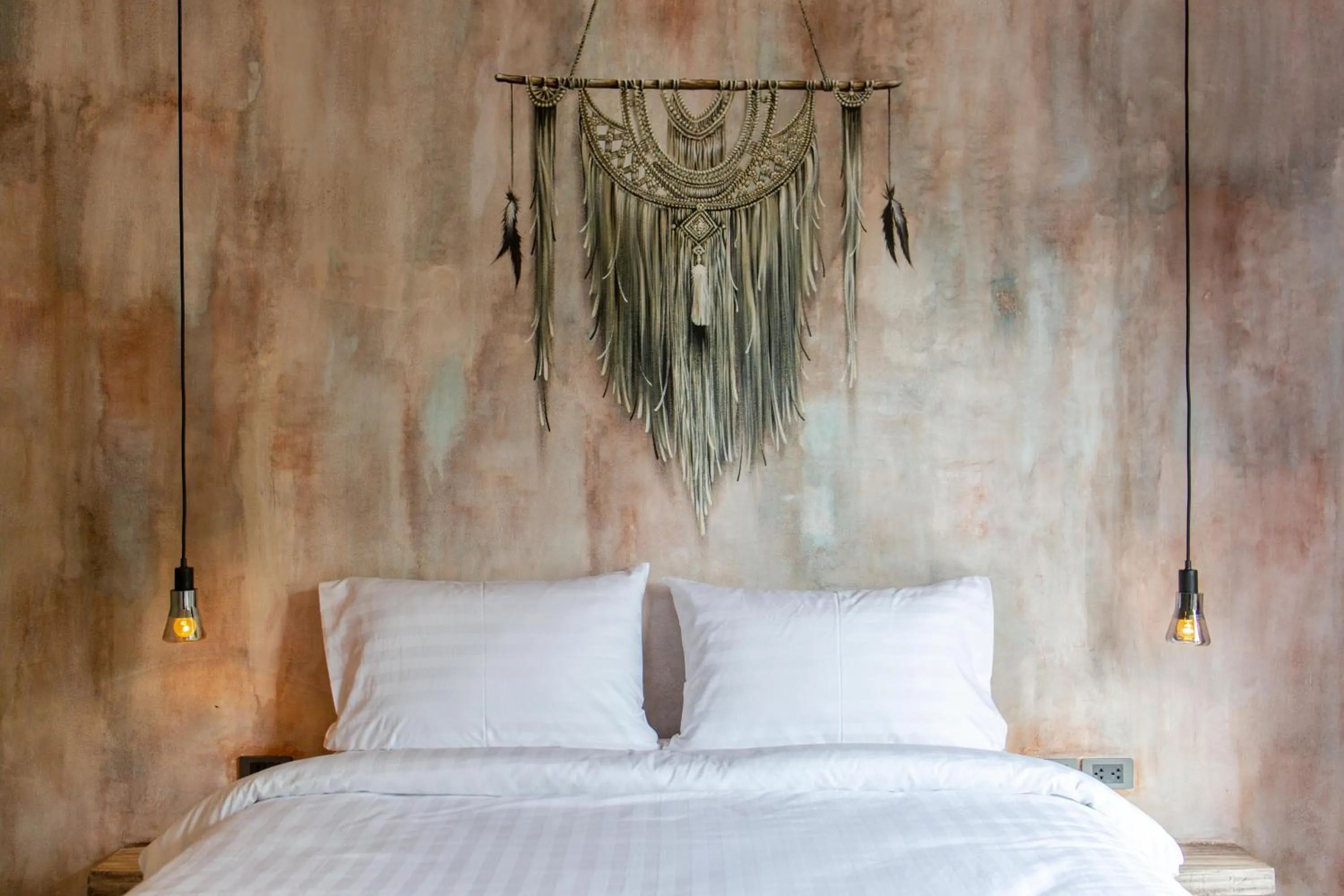 Bed in Dreamcatcher Boutique Hotel