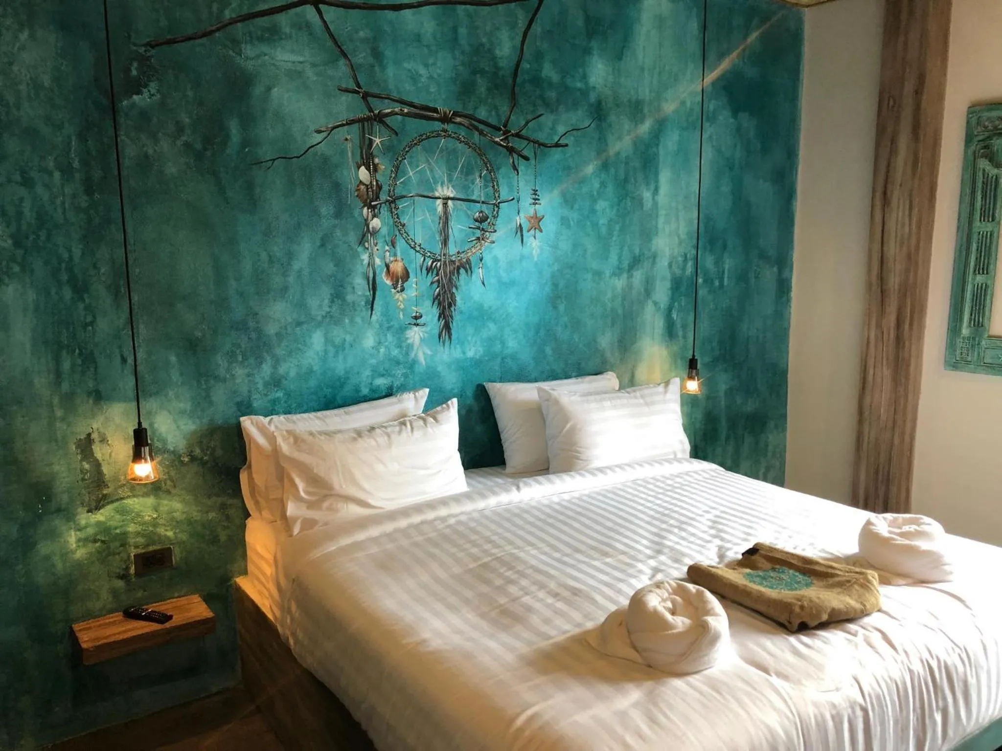 Bed in Dreamcatcher Boutique Hotel